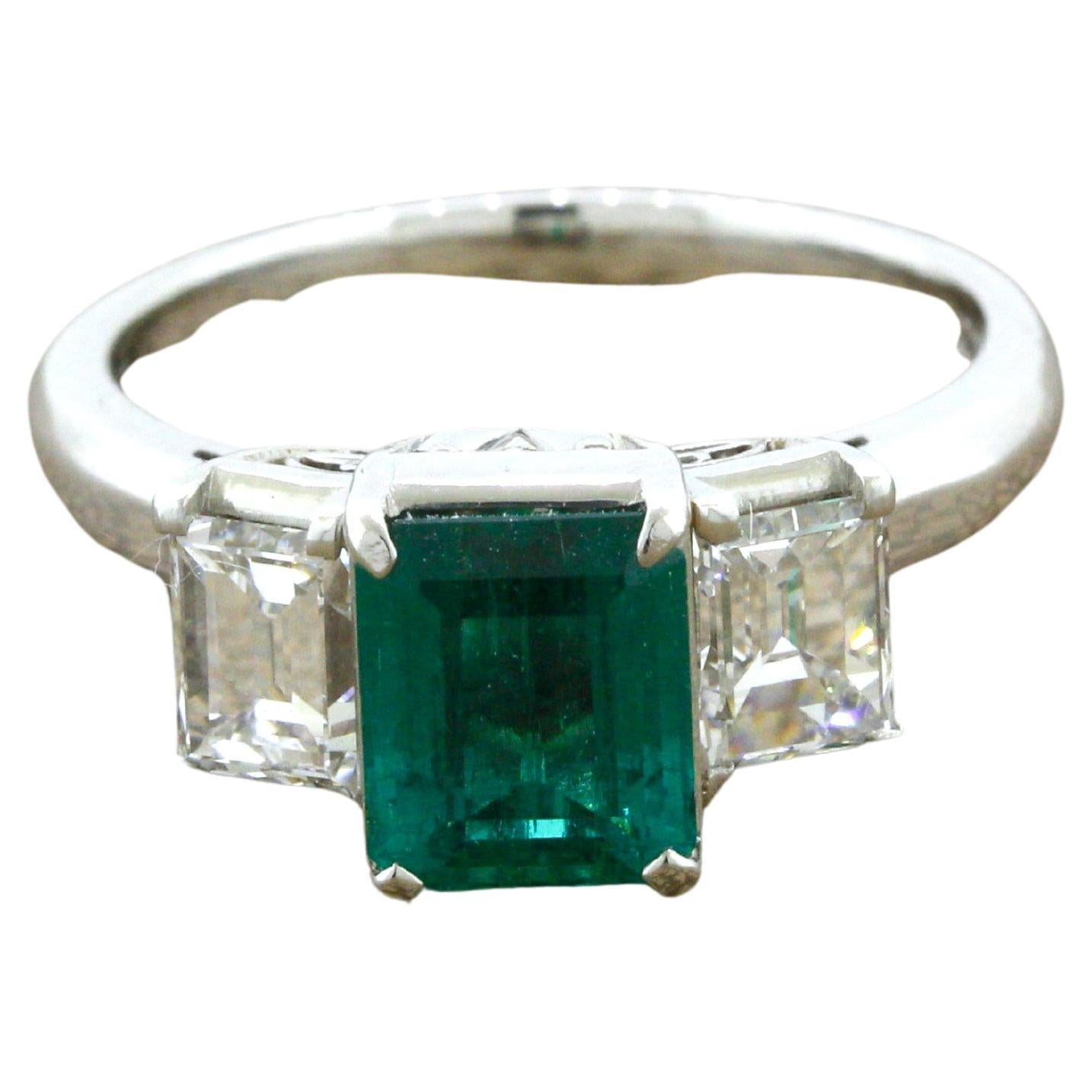 1.21 Carat Emerald Diamond 3-Stone Platinum Ring For Sale