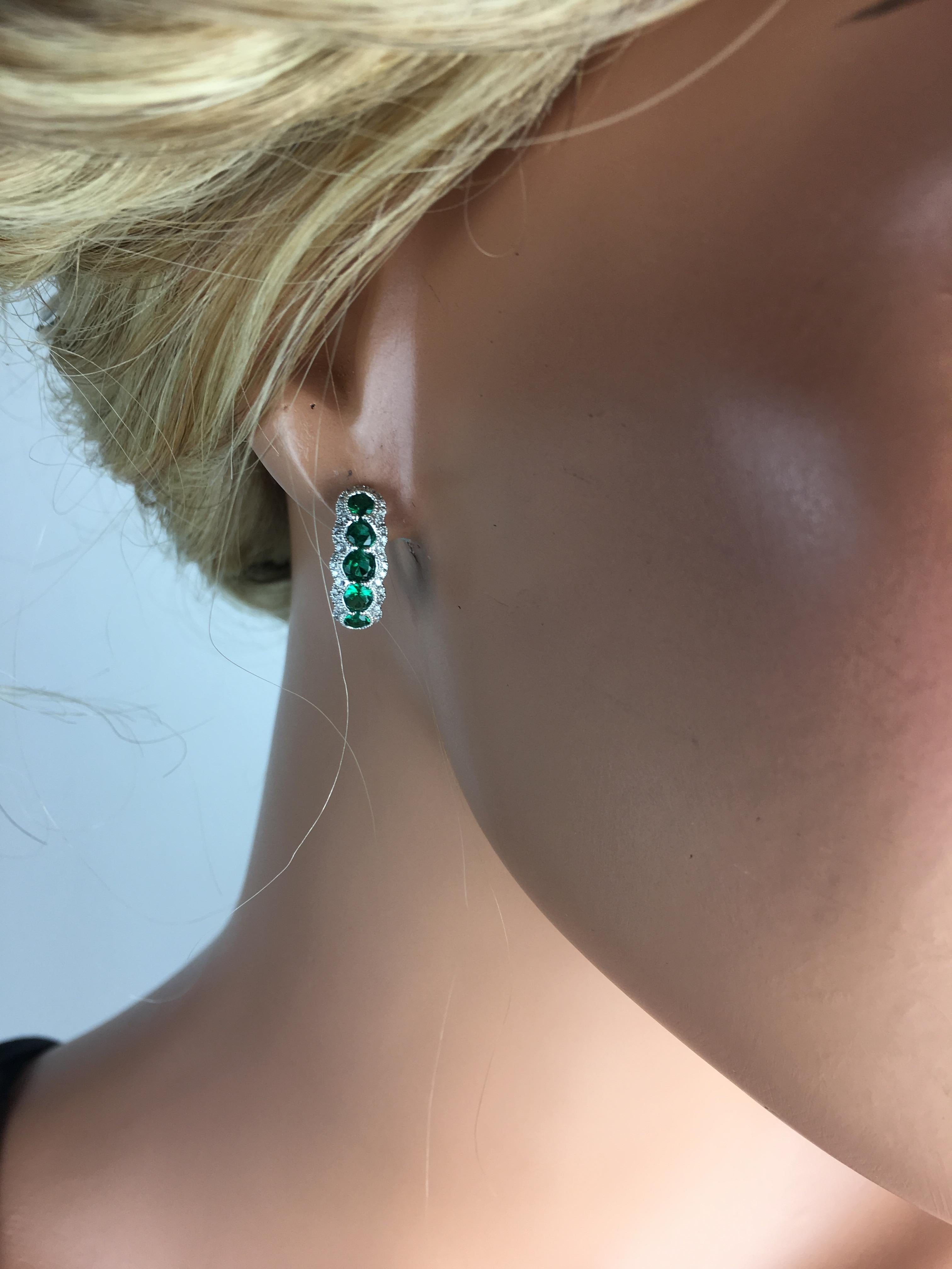 Enhance your elegance with these stunning handcrafted hoop stud earrings, featuring 1.21 carats of fine emeralds. Their vivid green hue is a symbol of rebirth, growth, and prosperity, making these earrings not just a piece of jewelry but a statement