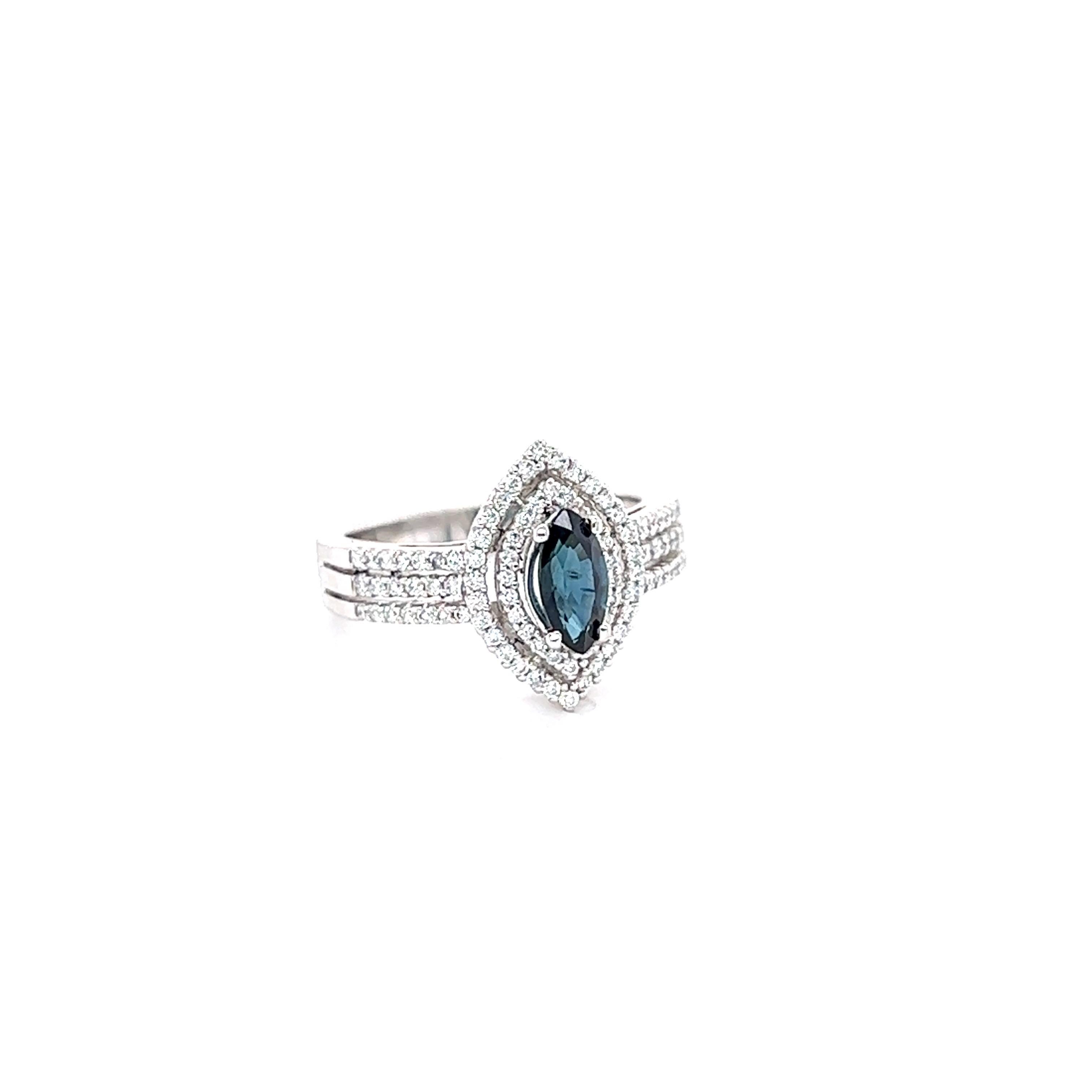 This beautiful ring has a 0.80 Carat Marquise Cut Blue Sapphire that measures at 8 mm x 4 mm and is surrounded by 94 Round Cut Diamonds that weigh 0.41 Carats. The Total Carat Weight of the ring is 1.21 Carats.  
The ring is made in 18K White Gold