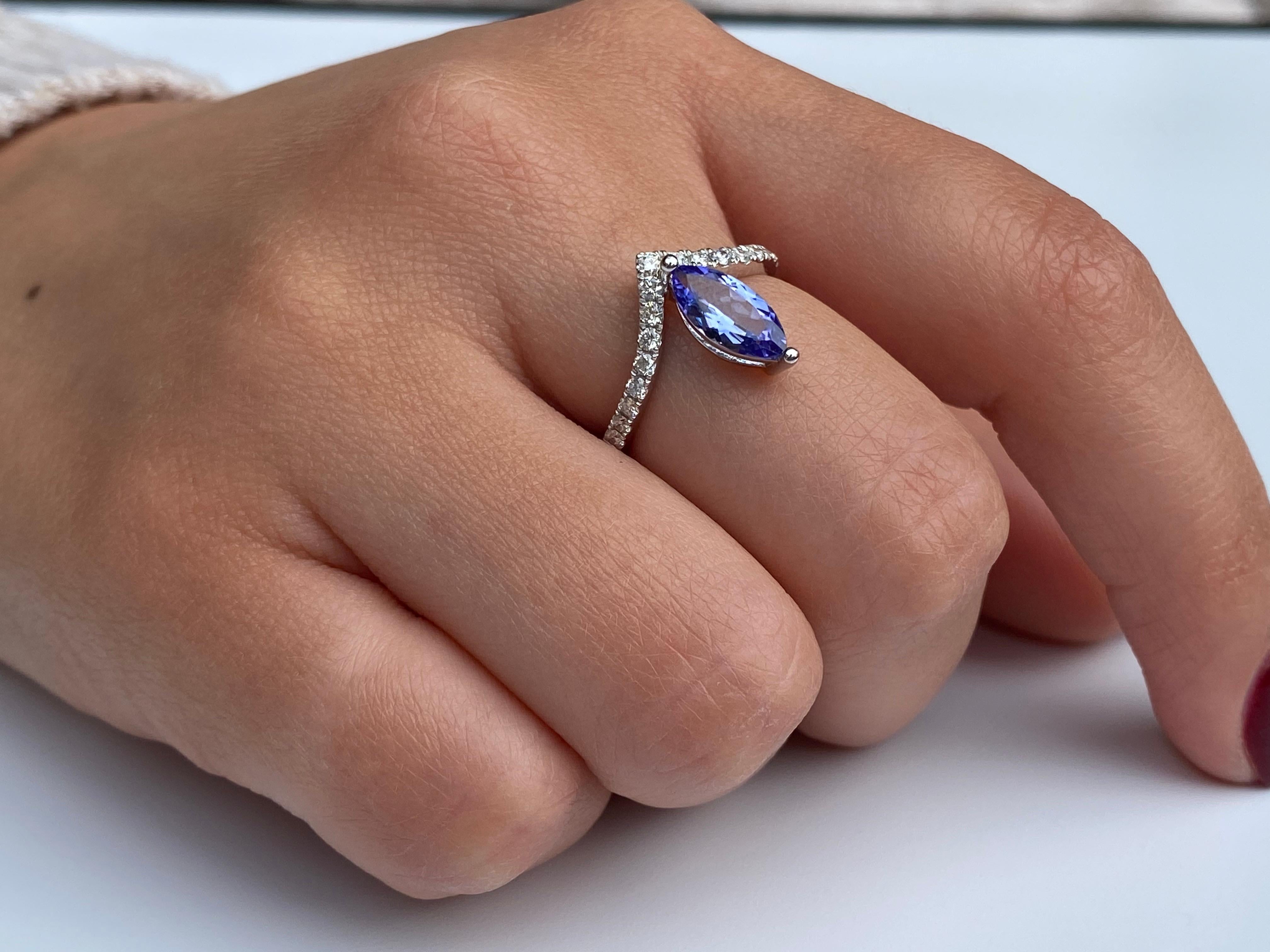 Centering a 0.92 Carat Marquis-Cut Violet Tanzanite, accented by 0.31 carats of Round-Brilliant Cut Diamonds, and set in 18K White Gold. 


Details:
✔ Stone: Tanzanite 
✔ Setting: 18k white gold
✔ Tanzanite Carat: 0.92 carats
✔ Tanzanite Origin:
