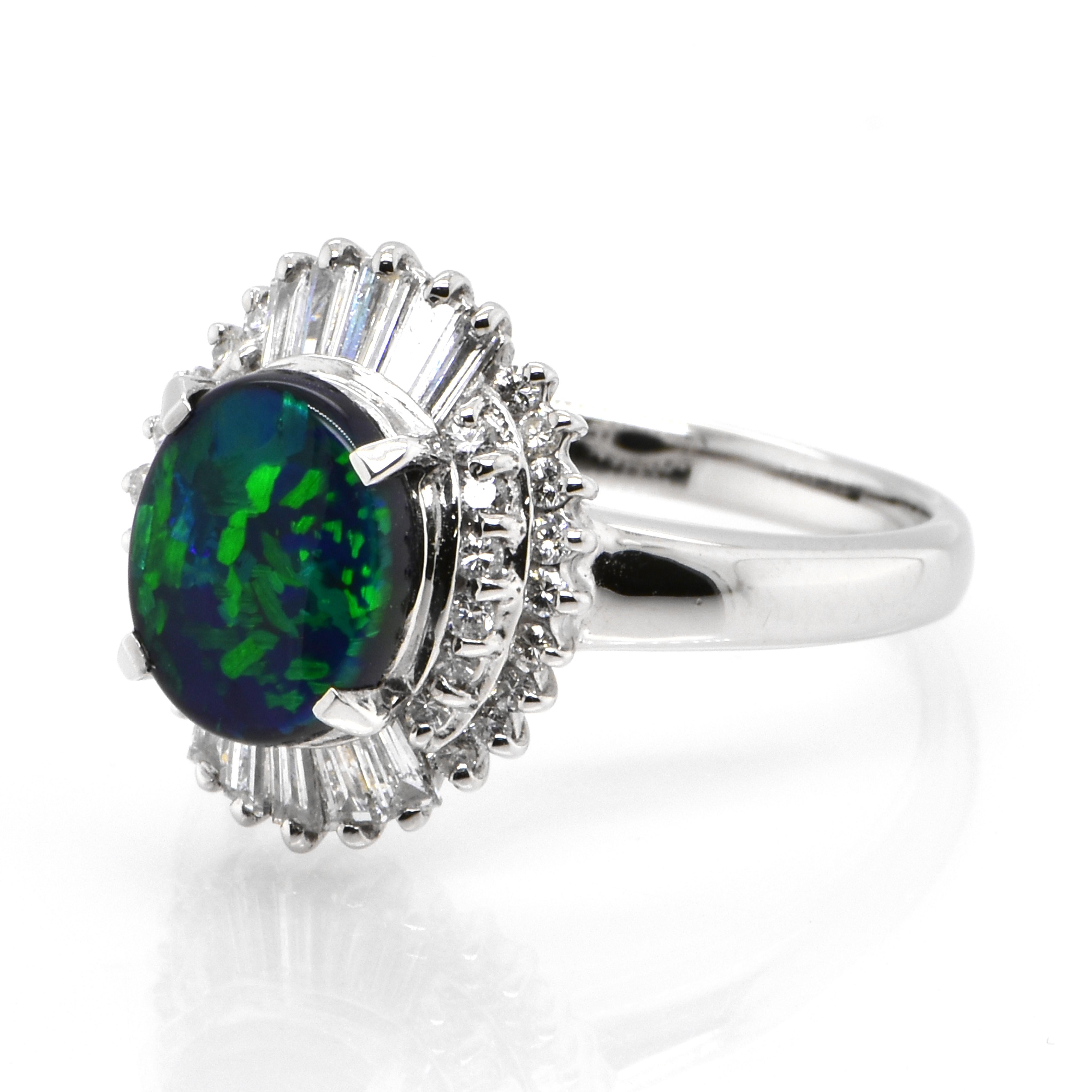 A beautiful ring featuring a 1.21 Carat, Natural, Australian Black Opal and 0.43 Carats of Diamond Accents set in Platinum. The Opal displays very good play of color! Opals are known for exhibiting flashes of rainbow colors known as 
