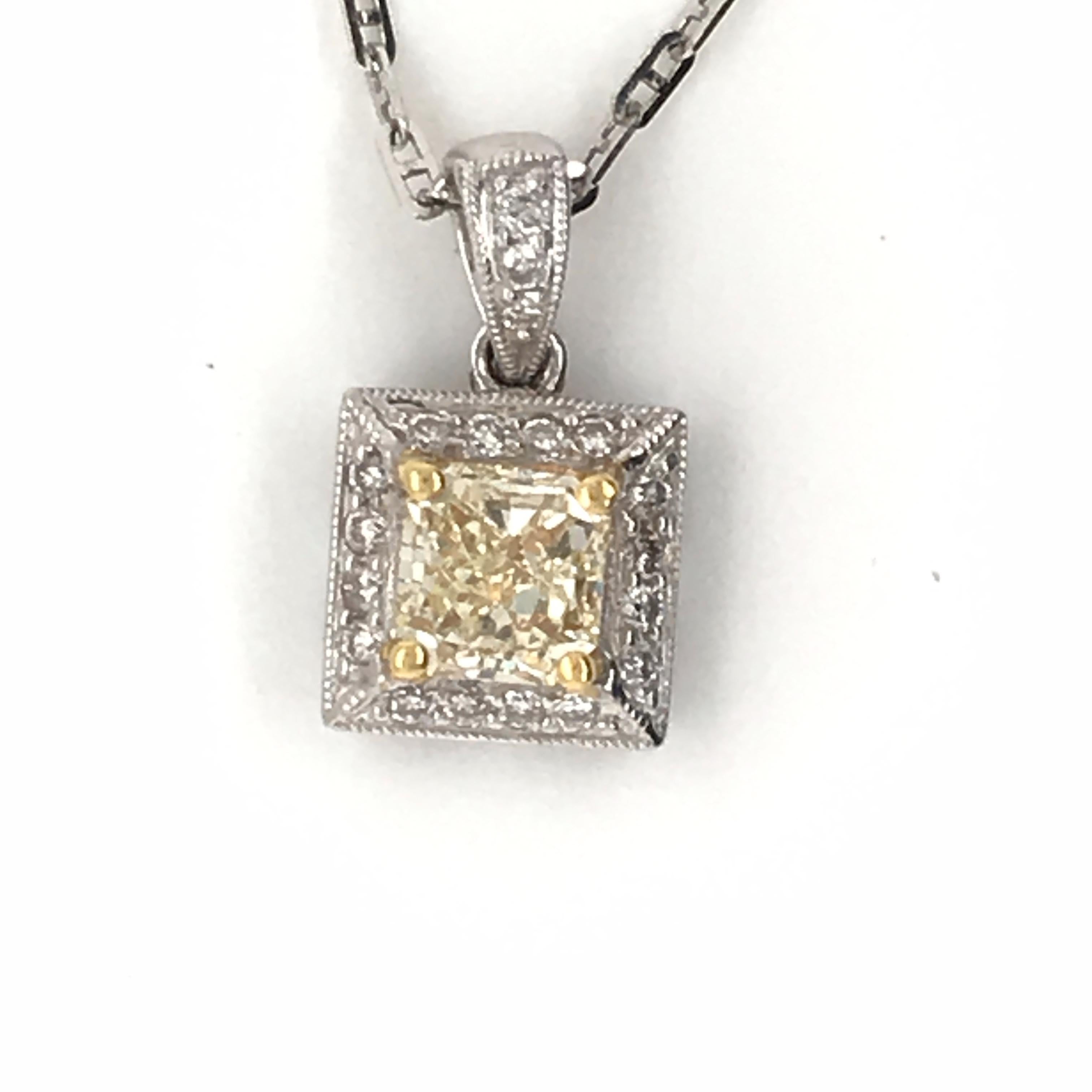 HJN Inc. Ring featuring a 1.21 Carat Natural Yellow Diamond Pendant.

Natural Yellow Diamond Weight: 1.06 Carats
Round-Cut Diamond Weight: 0.15 Carats

Total Stones: 19
Clarity Grade: SI1
Color Grade: H
Total Diamond Weight: 1.21
Polish and