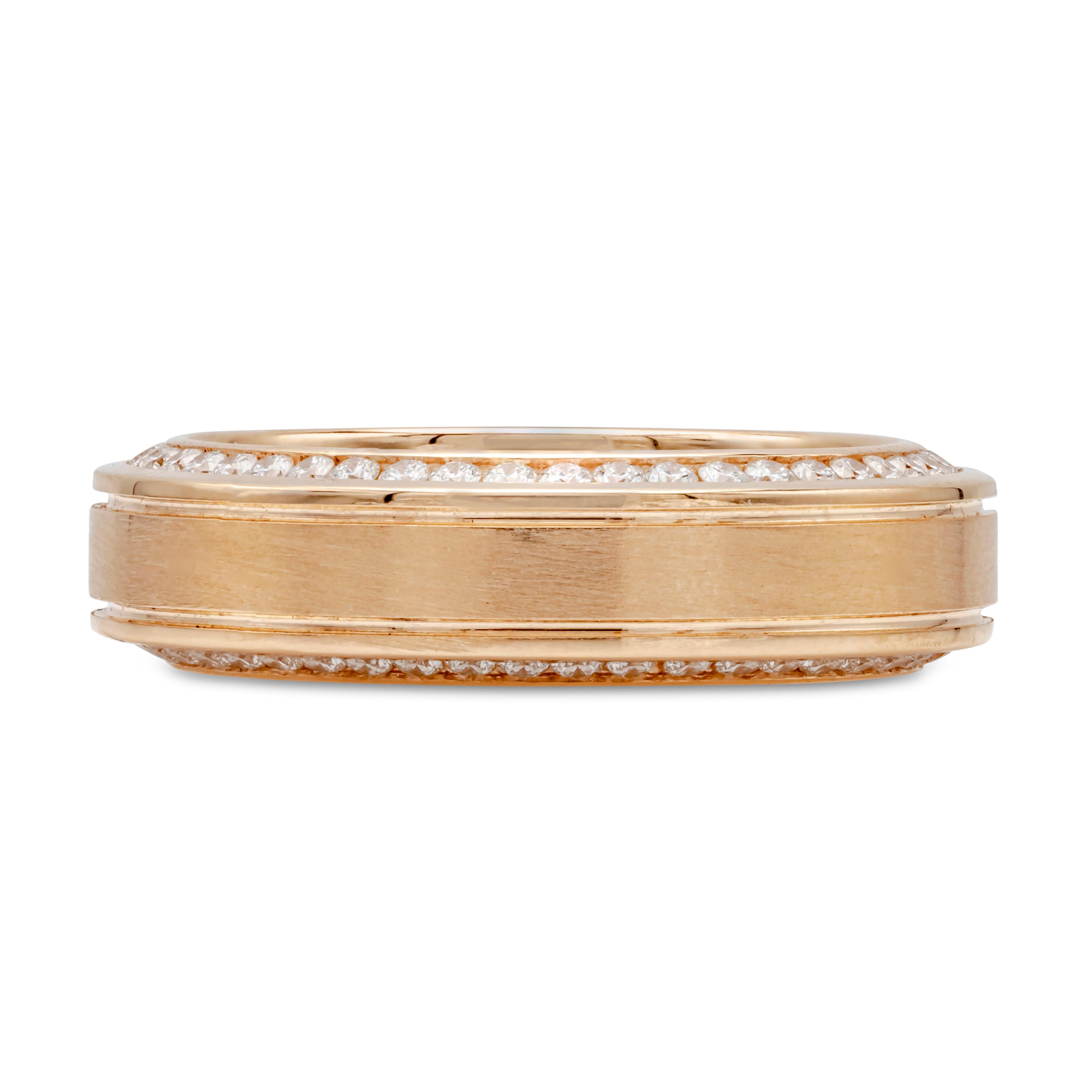 A comfort fit wedding band wrapped with round brilliant diamonds weighing 1.21 carats total; channel set on each side of the ring. Two lines finely-engraved in the middle portion of the ring and made in 18k rose gold. Gorgeous brushed inlay finish.