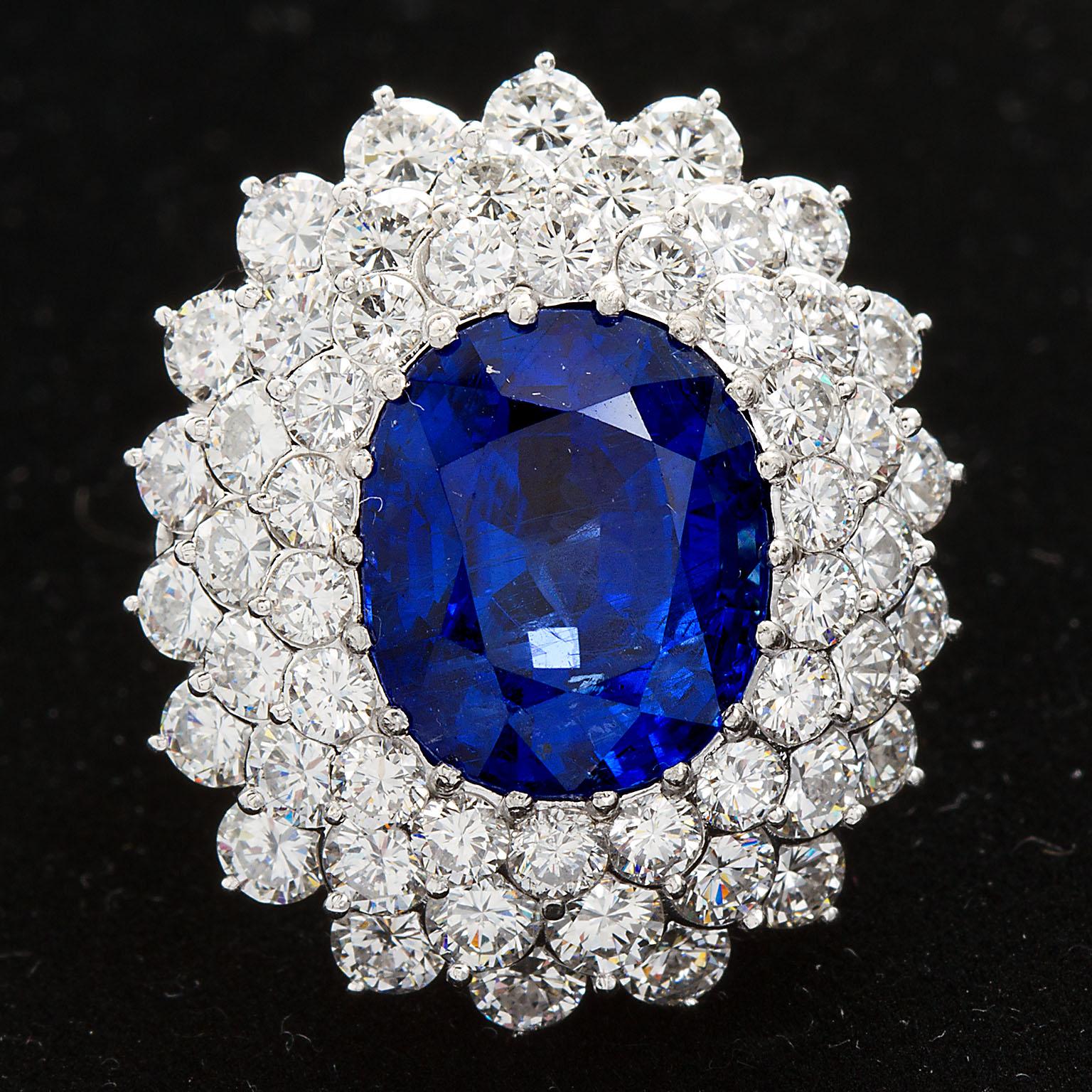 Contemporary 12.10 Carat Burma Unheated Oval Sapphire Diamond Cluster Ring