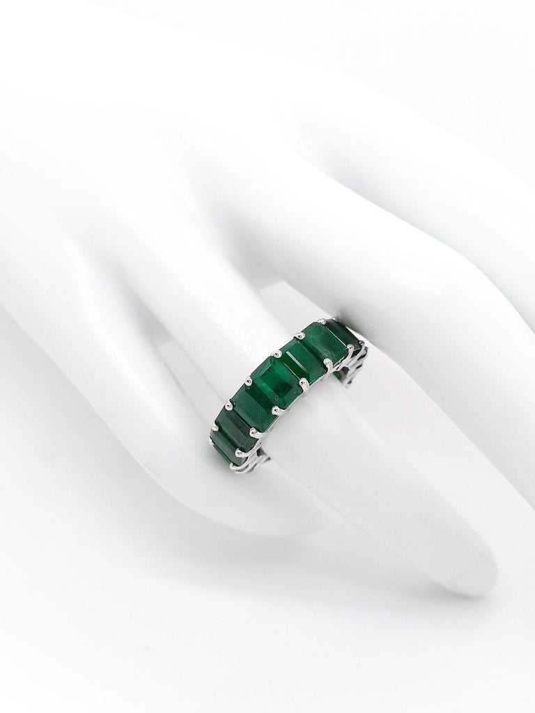 This breathtaking 12.19-carat emerald eternity ring is truly unique and mesmerizing with its 17 emeralds set in 14kt white gold. 
For more information, please check the attached certificate.

FOR U.S. BUYERS NO VAT