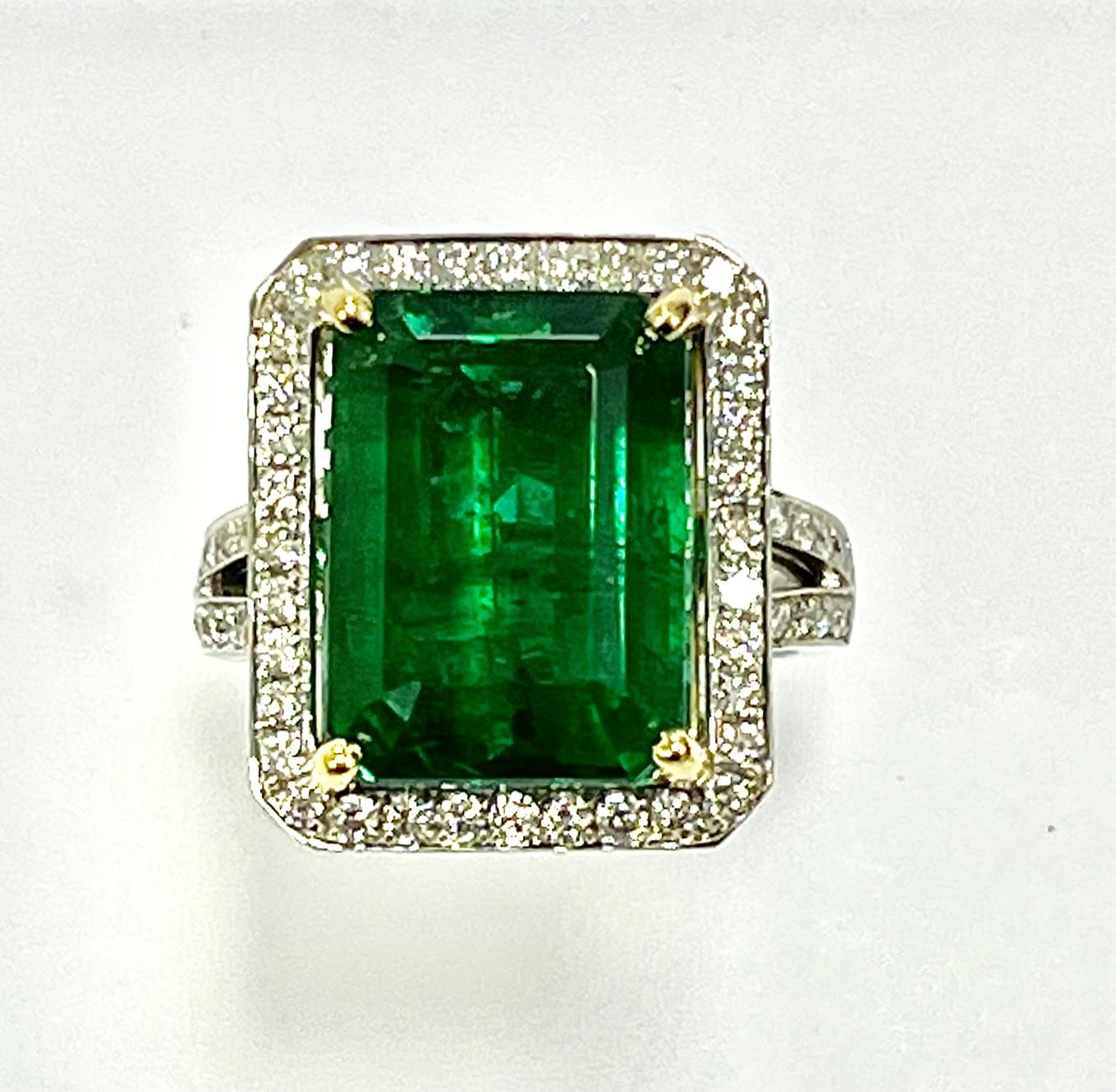 12.12 Carat Emerlad cut emerald set in 18k white gold ring with 1.59 carat diamonds . This item's assessment is based on our opinion.