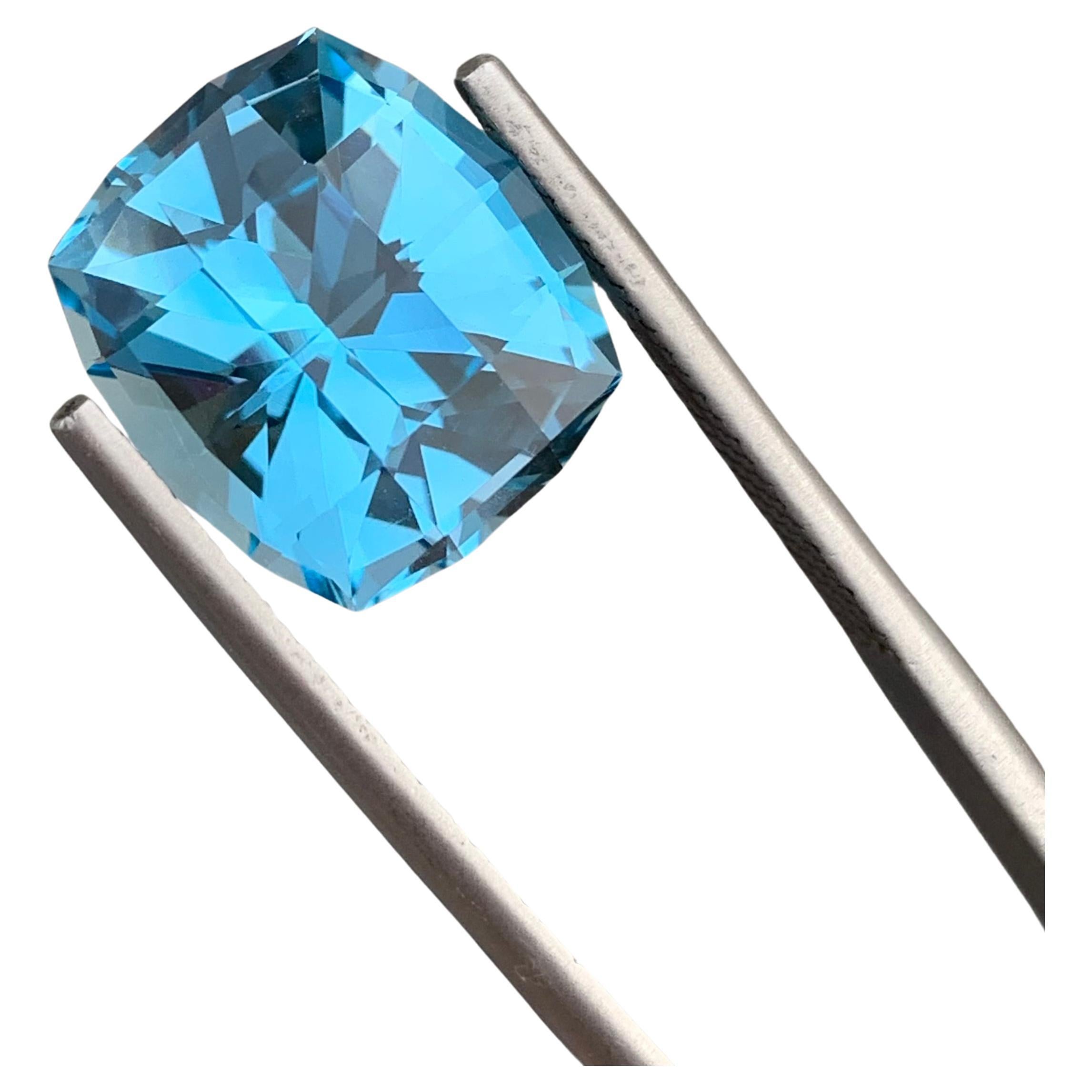 Loose Blue Topaz
Weight: 12.15 Carats
Dimensions: 14 x 12.8 x 9.2 Mm
Origin: Brazil
Shape: Can
Color: Blue
Certificate: On Demand

Benefits Of Wearing Blue Topaz Stone:
It helps to improve communication and self-expression.
It provides inner peace