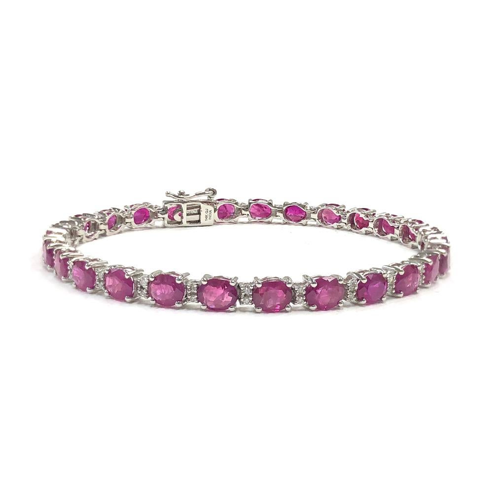 12.15 Carat Oval Shaped Ruby and 0.28 Carats Diamond 14K White Gold Tennis Bracelet

Center Stone Details: 
Stone: Ruby
Shape: Oval cut 
Size: 5mm x 4mm (27)
Weight: 12.15 carat

Diamond Details:
Shape: Round Brilliant (54)
Total Carat Weight: 0.28