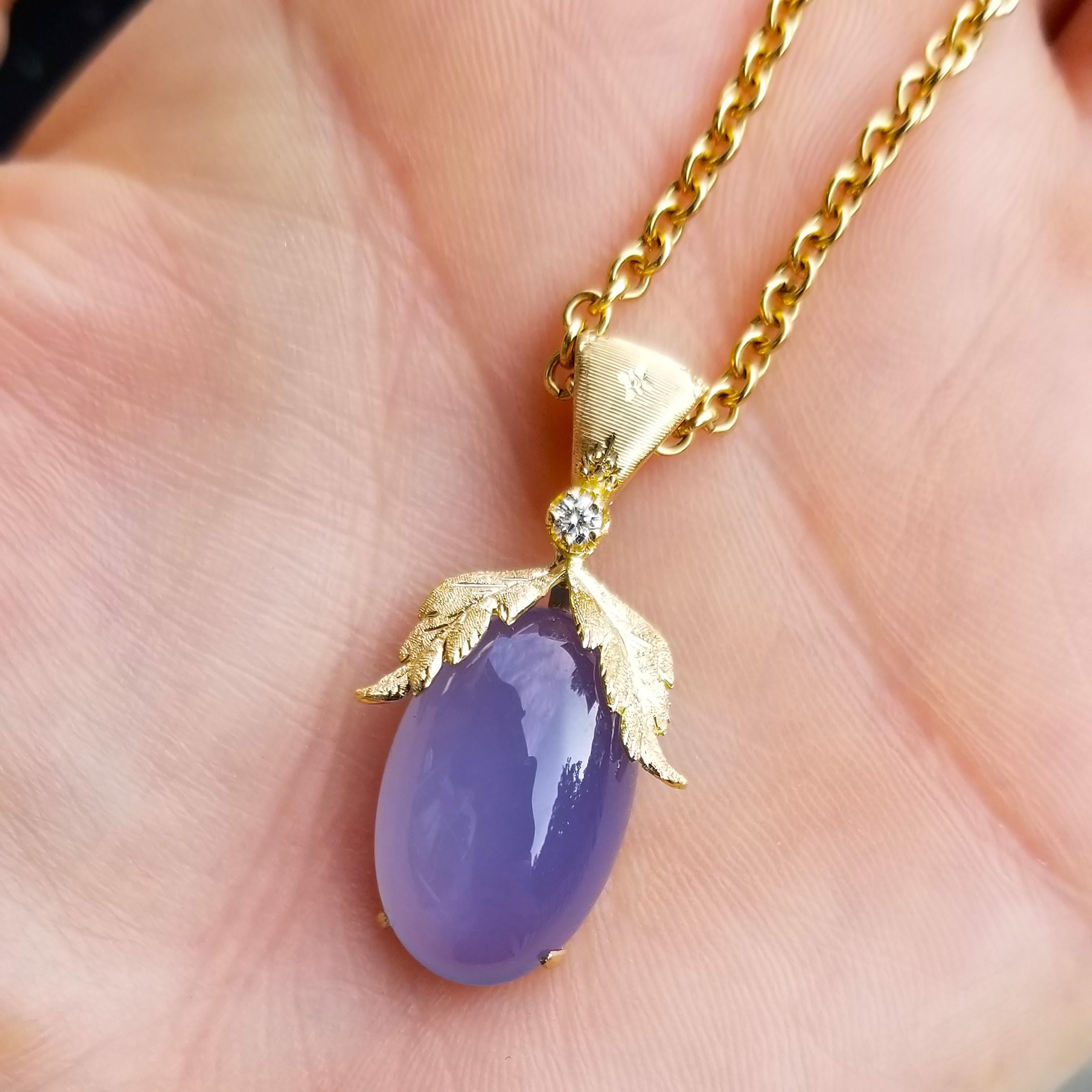 The luxuriously luminescent violet blue of this exquisite chalcedony is elegance personified.

The Sylvia pendant embraces this carefully chosen gemstone in richly detailed, Florentine engraved 18kt gold leaves. This pendant was masterfully crafted