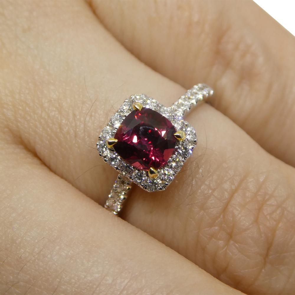 
Delight in the captivating allure of our Cushion-Cut Ruby and Diamond Ring, a testament to elegance and sophistication. At its core gleams a cushion-cut ruby, weighing 1.21 carats. This ruby, exuding a striking red hue with strong-vivid saturation