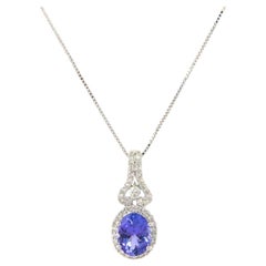 1.21ct Oval Tanzanite and 0.35ctw Diamond Accent Halo Pendant Necklace in 14K