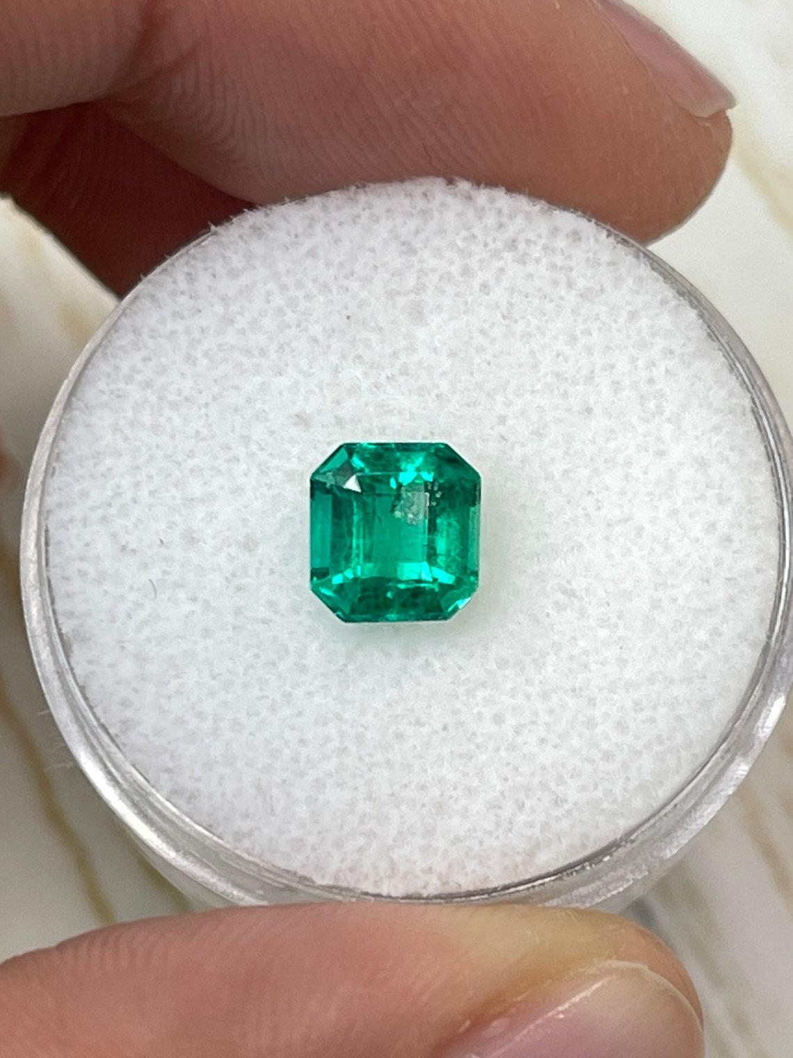 Stone: Emerald
Weight: 1.21-carats
Shape: Asscher Cut
Clarity: Transparent
Luster: Excellent
Color: Vivid Bluish Green
Measurements: 6.55mm x 6.19mm x 4.57mm
Geographic Origin: Colombia
Treatment: Natural, Oiling

Comments: Due to their growth
