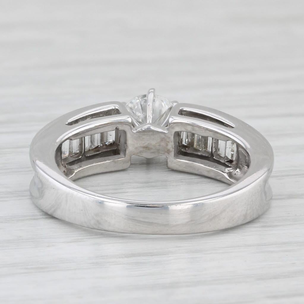 Gemstone Information:
- Natural Diamond -
Carats - 0.59ct 
Cut - Round Brilliant
Color - G - H
Clarity - SI2- I1

- Natural Diamonds -
Total Carats - 0.62ctw
Cut - Baguette
Color - G - H
Clarity - VS2 - SI1

Metal: 14k White Gold
Weight: 5.5 Grams