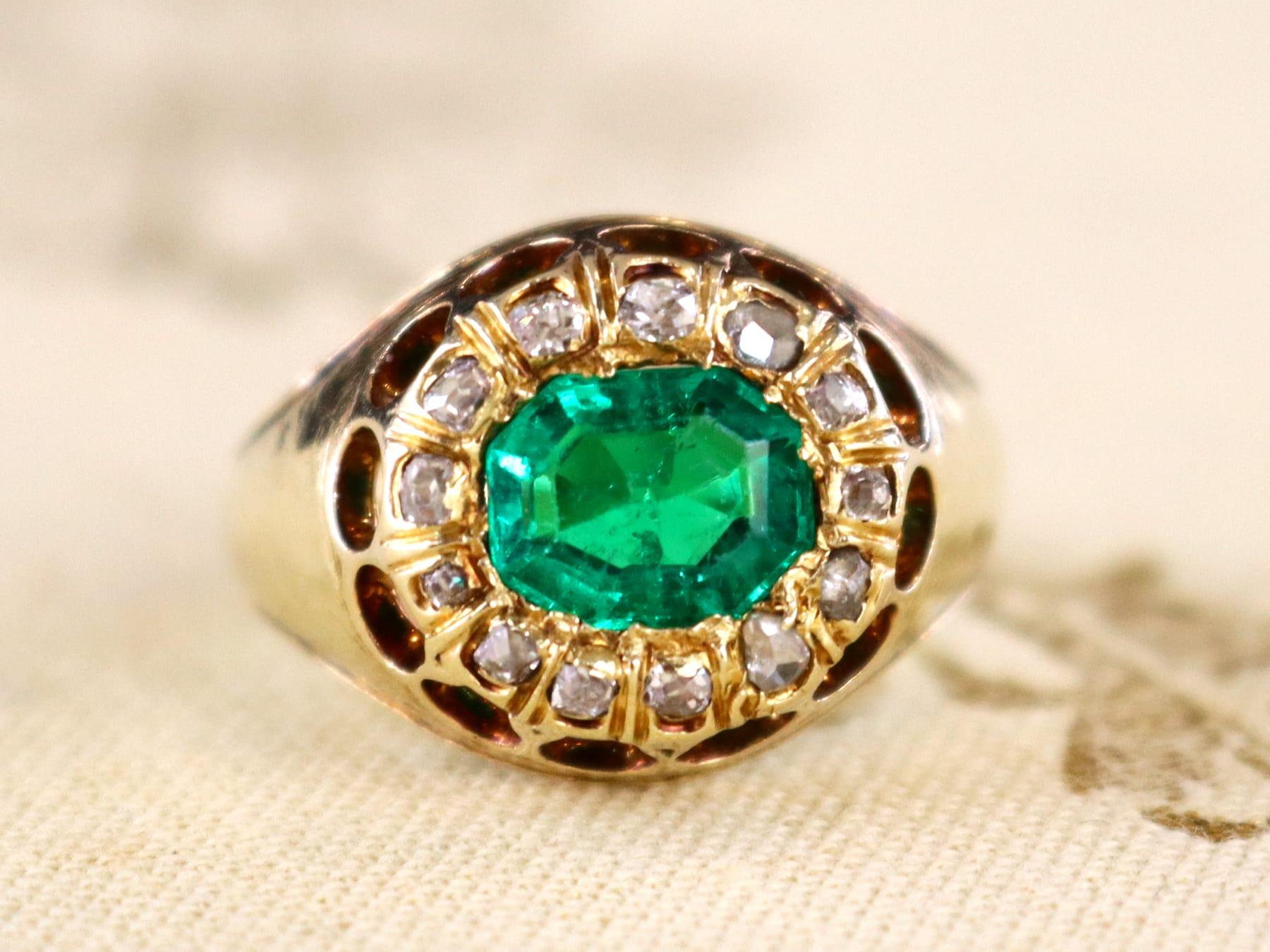 A stunning, fine and impressive antique 1.22 carat natural Colombian emerald and 0.26 Ct diamond, 14k yellow gold dress ring; part of our antique jewelry/estate jewelry collections.

This stunning French antique emerald ring has been crafted in 14k