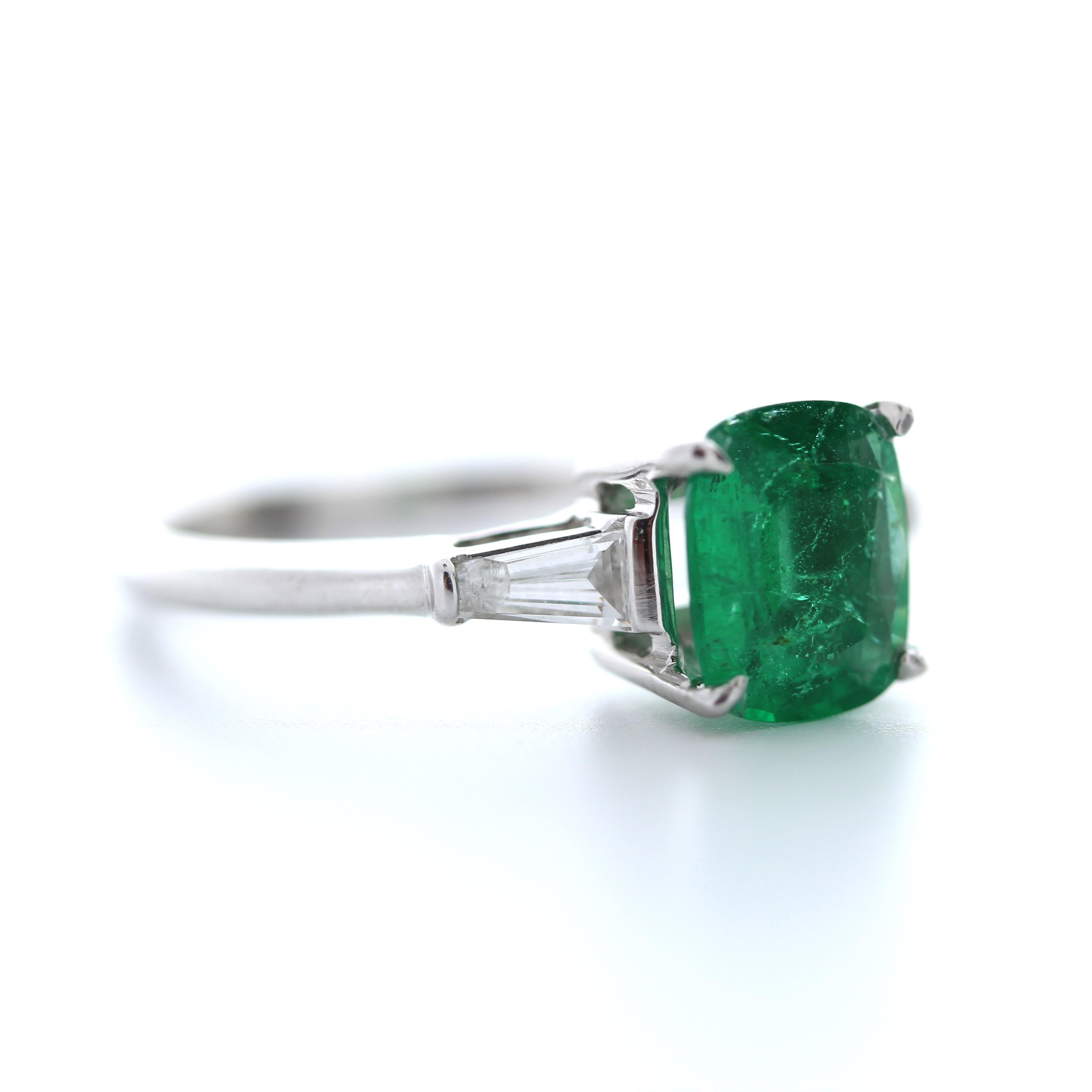 Would you look at this beauty! Simple in design, but there is nothing ordinary about the gorgeous color of this breathtaking green emerald ring. This stunning piece features a emerald cut 1.22 carats emerald, set into a four-prong. It is accompanied