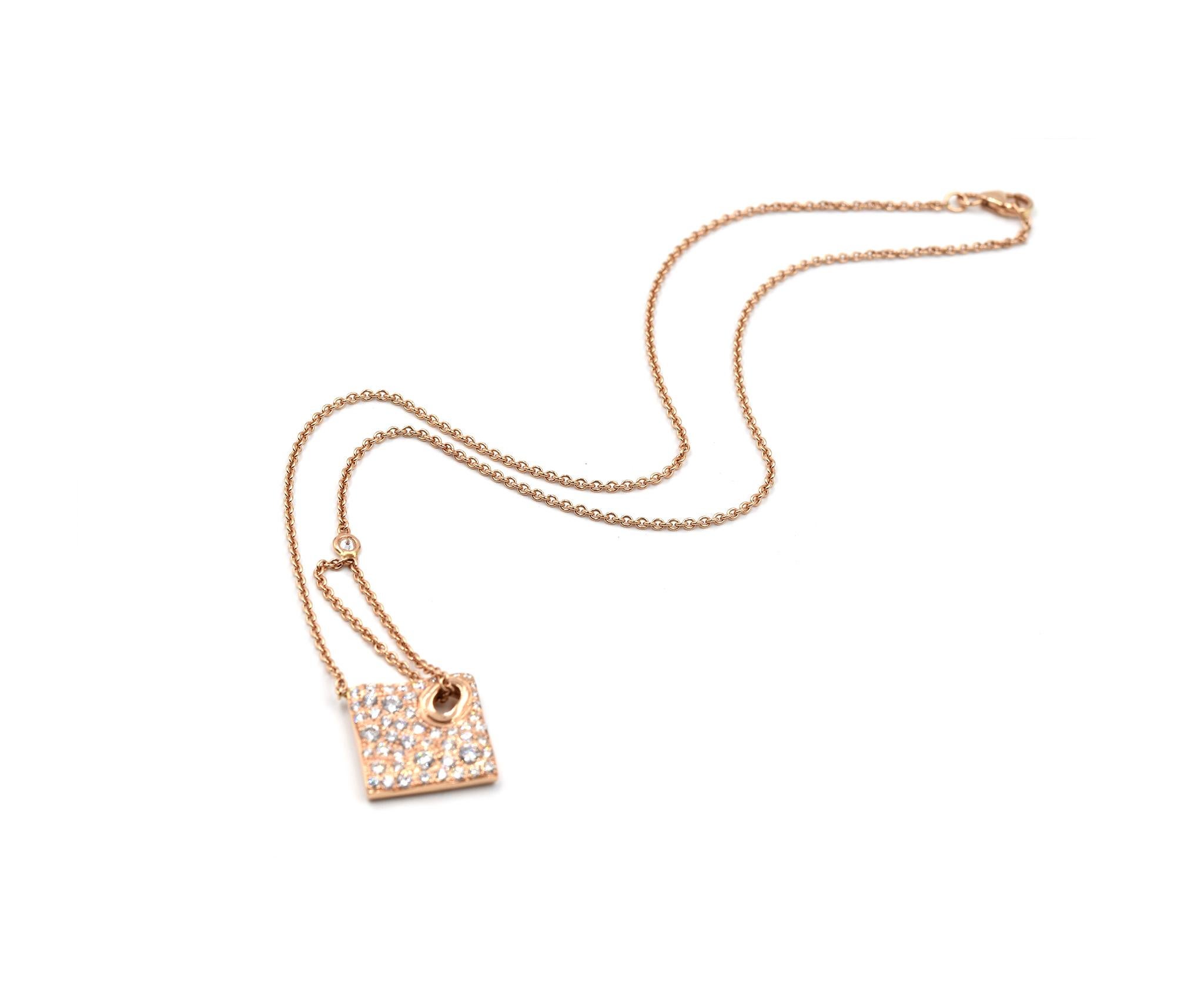 Designer: custom design
Material: 14k Rose Gold
Diamonds: 1.22cttw
Color: G	
Clarity: VS
Dimensions: necklace is 16-inch long
Weight: 8.81 grams
