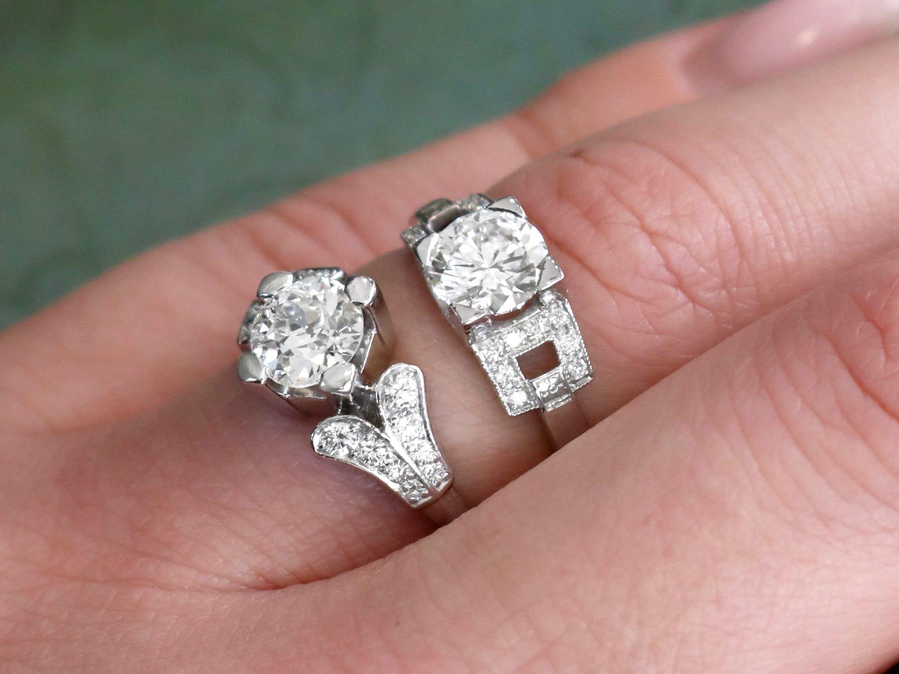 A stunning, fine and impressive vintage 1.22 carat diamond (total) and contemporary platinum solitaire ring; part of our diamond jewelry/estate jewelry collections.

This stunning, fine and impressive 1.1 carat diamond solitaire ring has been