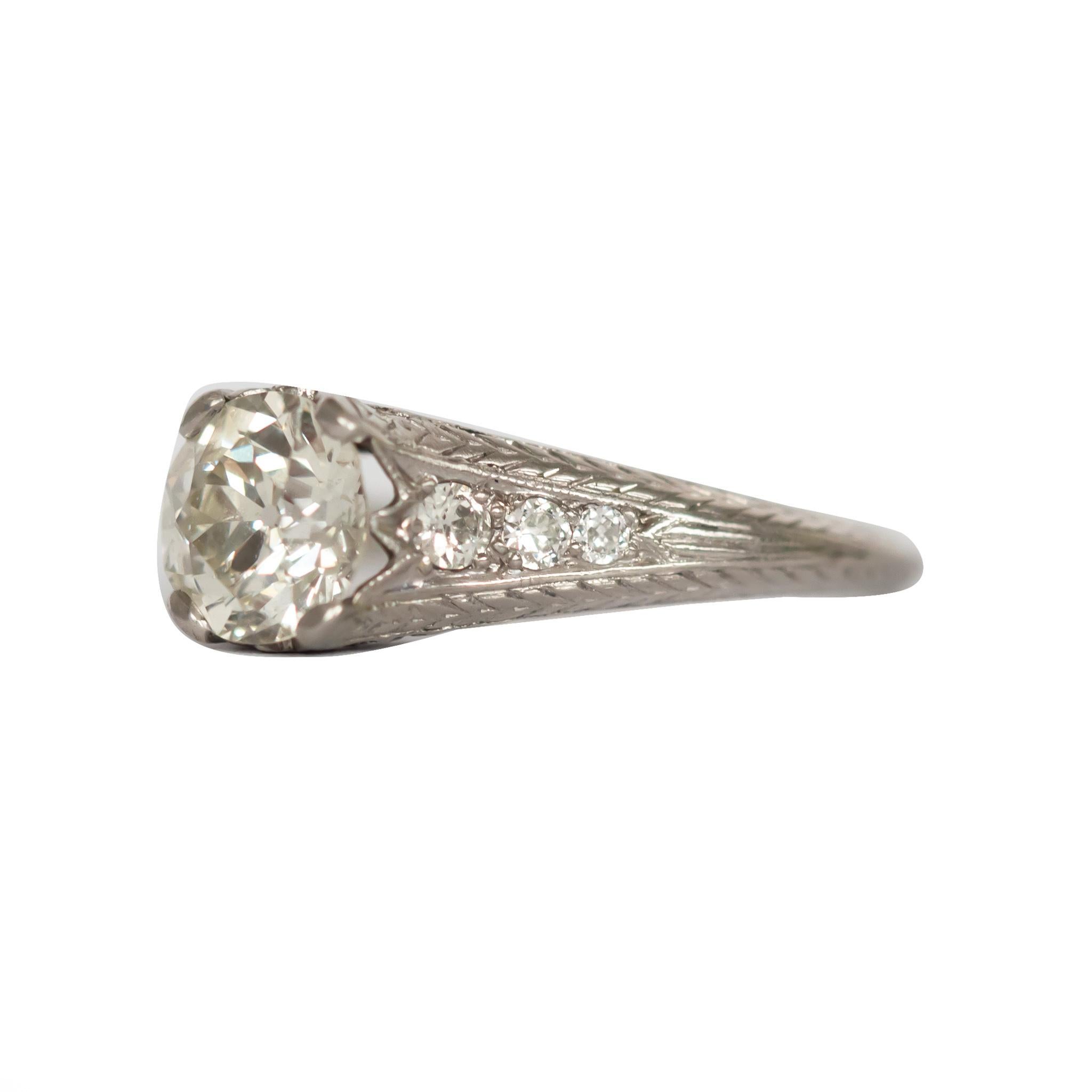 Ring Size: 7
Metal Type: Platinum [Hallmarked, and Tested]
Weight: 2.5 grams

Center Diamond Details:
Weight: 1.22 carat
Cut: Old European Brilliant
Color: K
Clarity: VS1

Side Diamond Details:
Weight: .15 carat, total weight
Cut: Old European