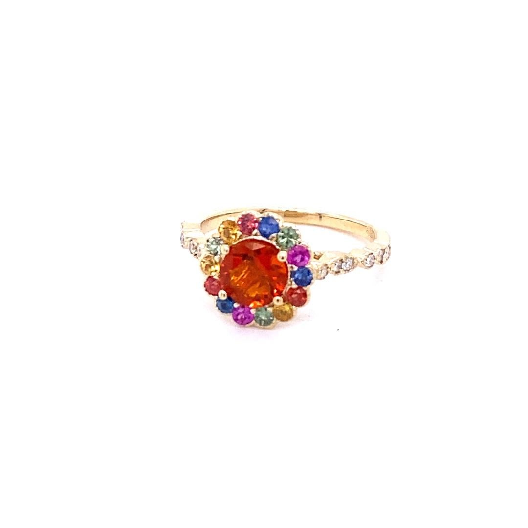 1.22 Carat Fire Opal Sapphire Diamond Yellow Gold Cocktail Ring

This ring has a 0.57 carat Round Cut Fire Opal in the center of the ring and is surrounded by a halo of 14 Multi- Colored Sapphires that weigh a total of 0.52 carats and there are 12