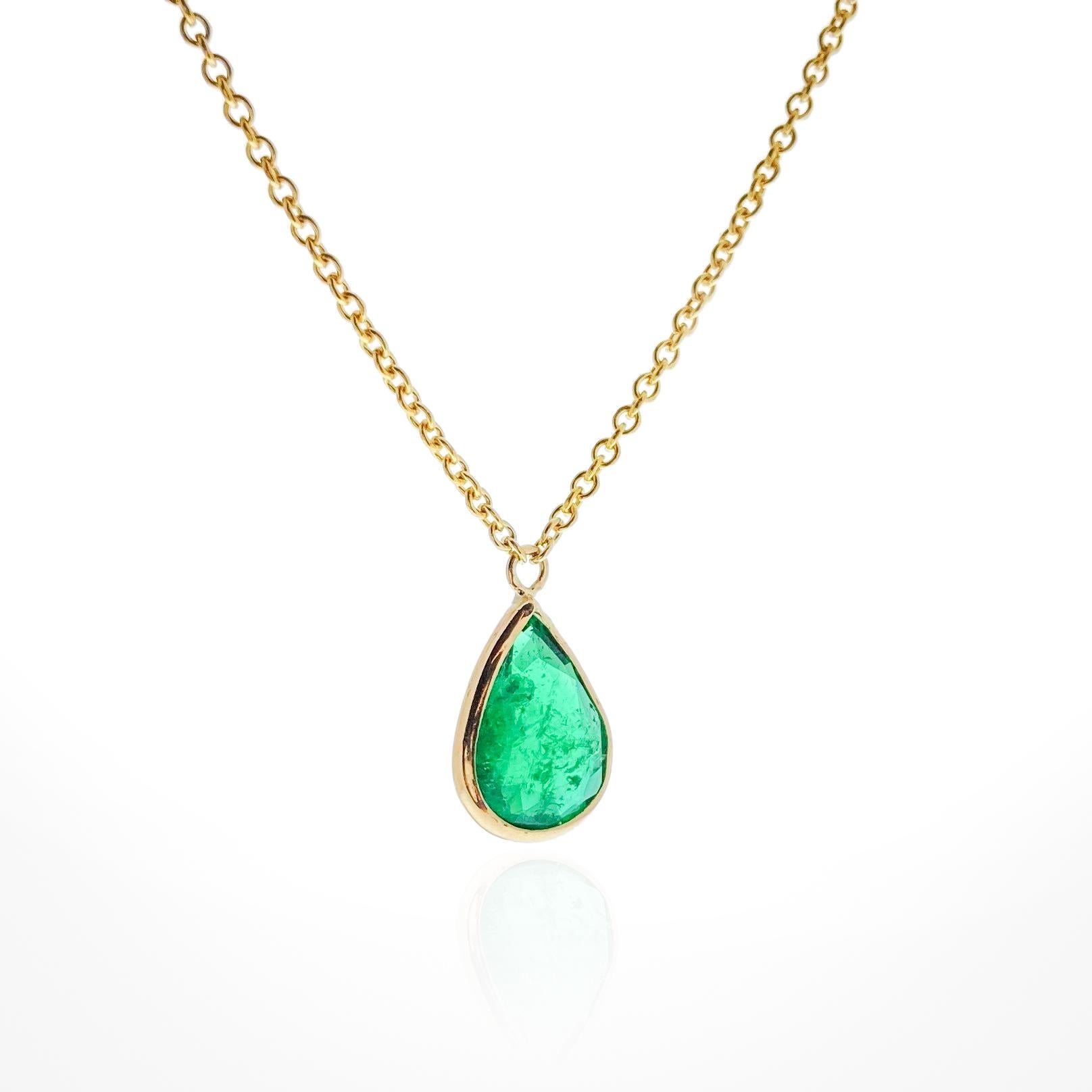 This necklace features a pear-cut green emerald with a weight of 1.22 carats, set in 14k yellow gold (YG). Emeralds are highly prized for their rich green color, and the pear cut, with its distinctive teardrop shape, adds an elegant and unique touch