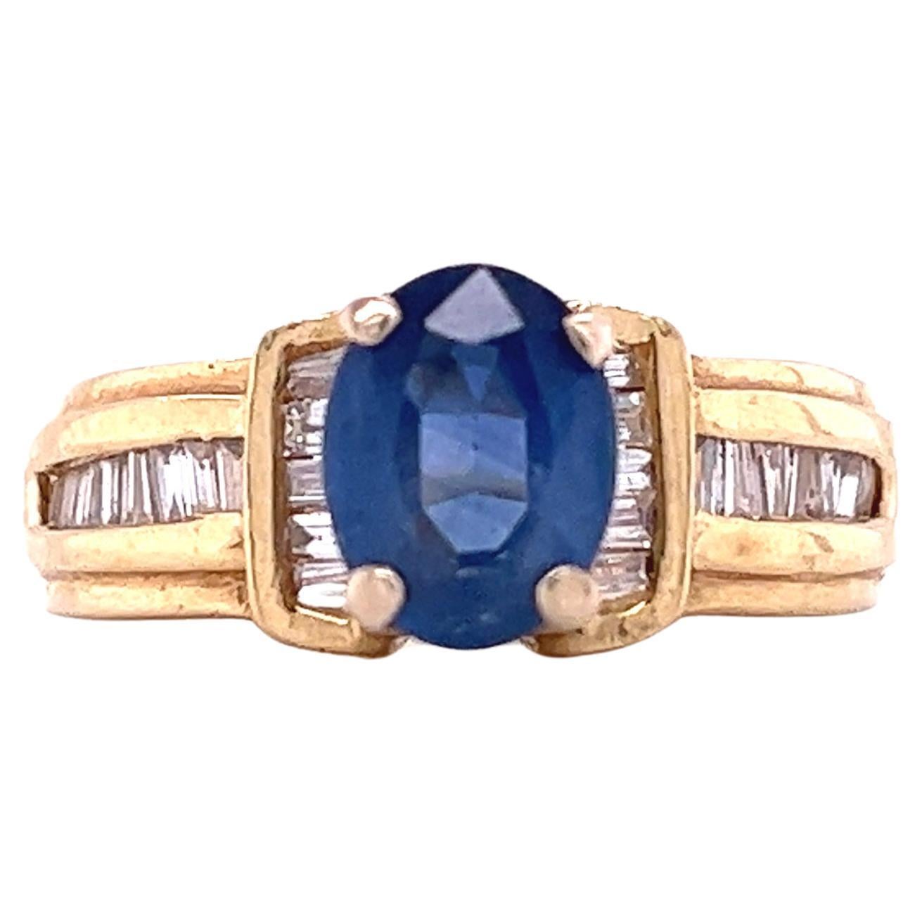 1.22 Carat Oval Cut Blue Sapphire with Baguette Cut Diamond in 14k Gold Ring For Sale