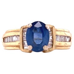 1.22 Carat Oval Cut Blue Sapphire with Baguette Cut Diamond in 14k Gold Ring