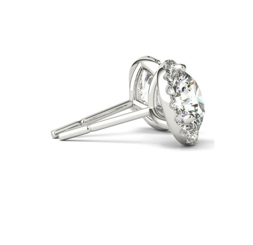 Contemporary 1.22 Carat Round Brilliant Cut Diamond Halo Stud Earrings in 14 Karat White Gold For Sale