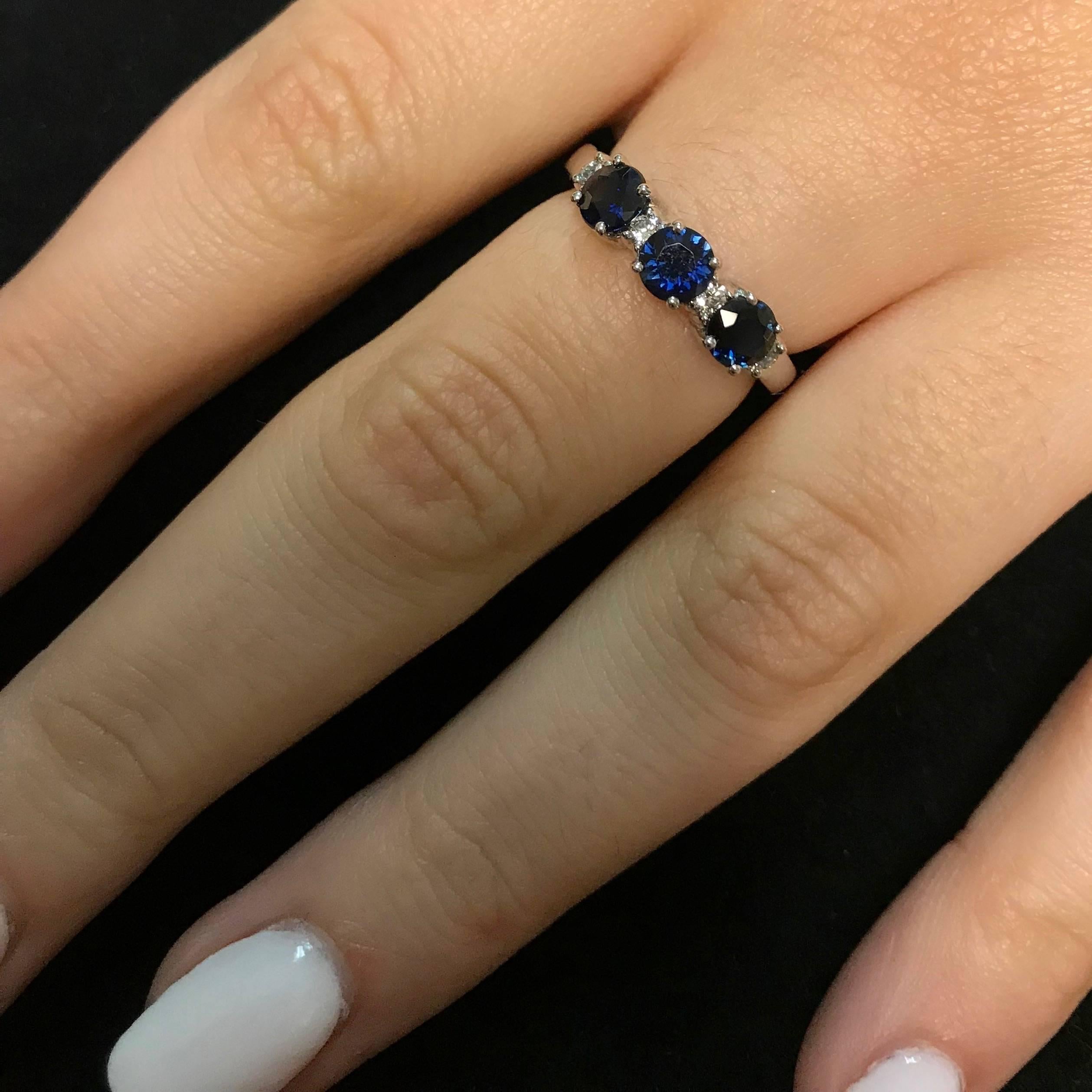 This beautiful band features 3 Blue Sapphires adorned with White Diamonds for a bold and colorful look!

Material: 14k White Gold
Gemstones: 3 Round Blue Sapphires at 1.22 carats. Measuring 4.4mm
Diamonds: 4 Round White Diamonds at 0.14 Carats.