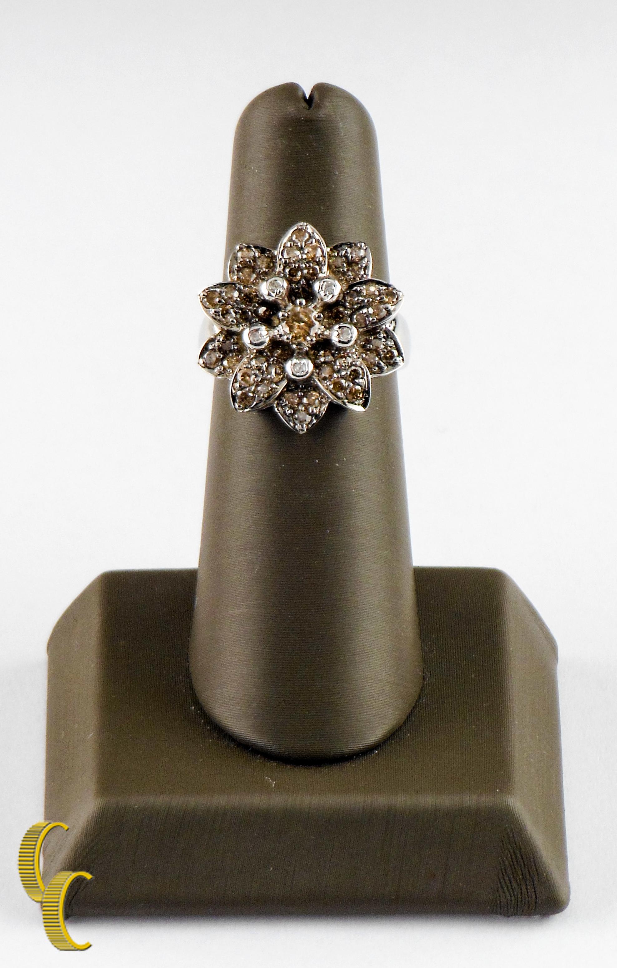 Features round fancy chocolate and white diamonds bead set in a flower setting w/ large round chocolate diamond in center
Ring size 7
Diameter of Flower = Approximately 20 mm
1.22 Carat total weight 
Total mass - 7.1 g
14K white gold 