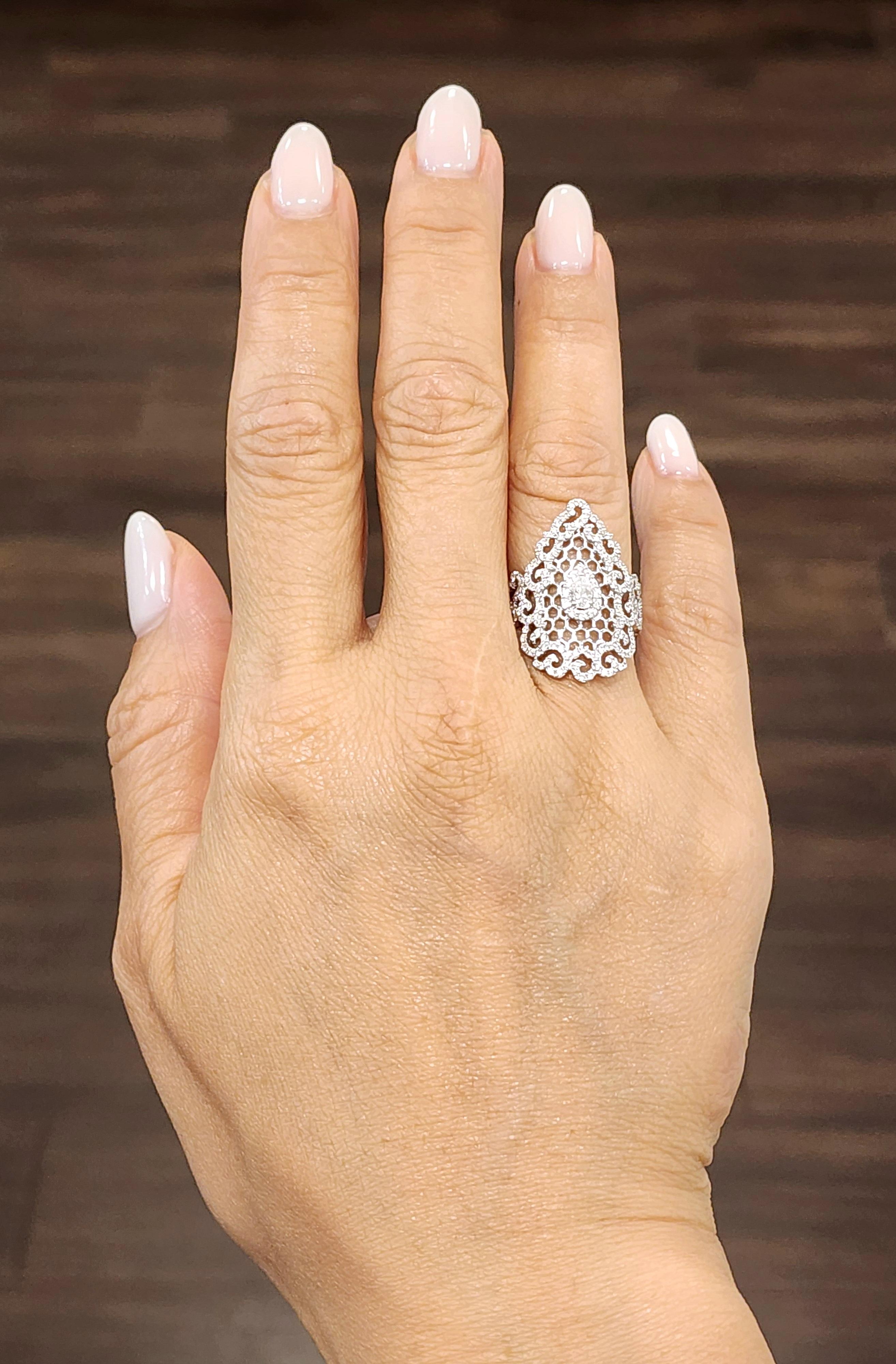 Add a touch of elegance to your collection with this stunning pear diamond ring. Crafted in 18k white gold, the ring features a single pear-shaped diamond with VS1/VS2 clarity and an E/F color grade. Surrounding the center stone are 179 smaller