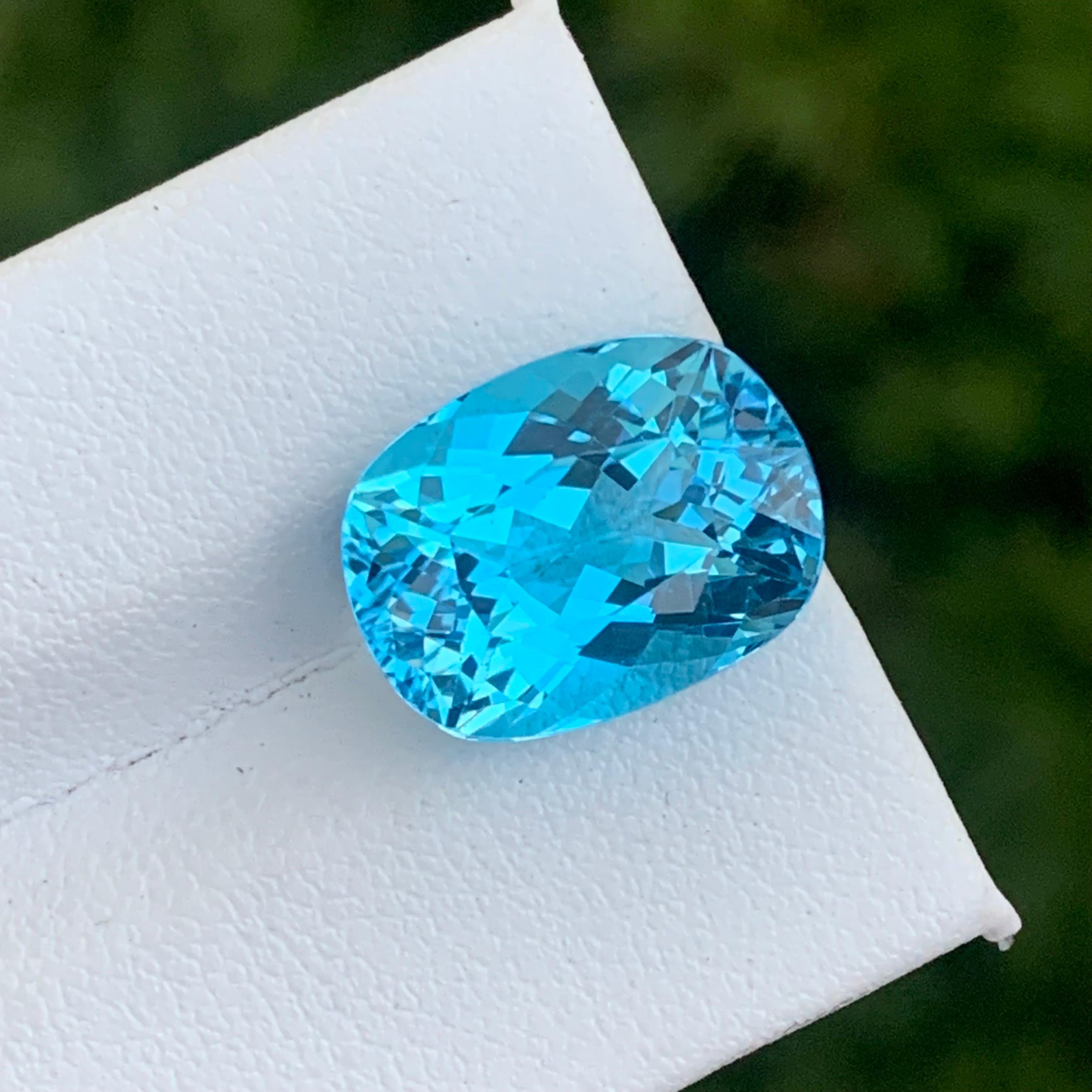 Beautiful Faceted Sky Blue Topaz
Weight: 12.20 Carats ⚖️
Dimension: 15x11.3x8.7 Mm ⚖️
Origin: Brazil
Shape: Long Cushion 
Certificate: On Demand 
.

Blue topaz, in particular, is believed to promote truth and forgiveness, relaxing the spirit as well