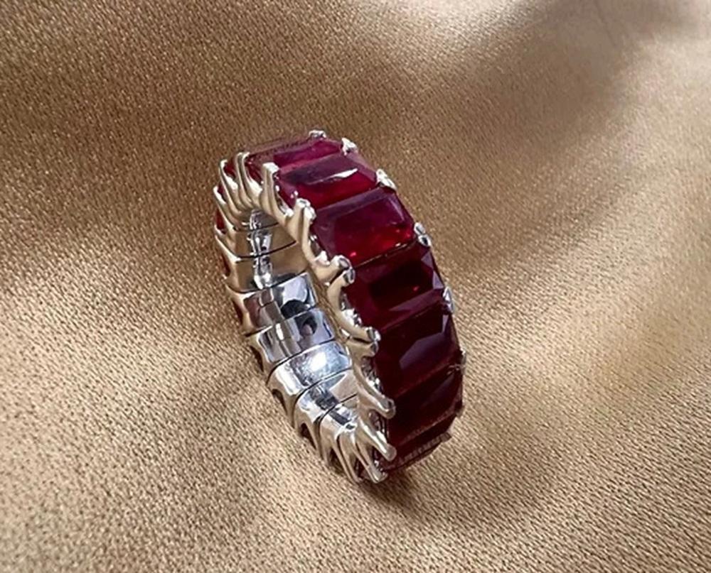 This item is made in an expandable style with our latest jewelry technology. All flexible pieces stretches 1-3+ sizes. Ruby Weight: 12.22 CTS, Measurements: 6x4 mm, Metal: 18K White Gold, Ring Size: 6-8, Shape: Emerald-Cut, Color: Red, Hardness: 9,