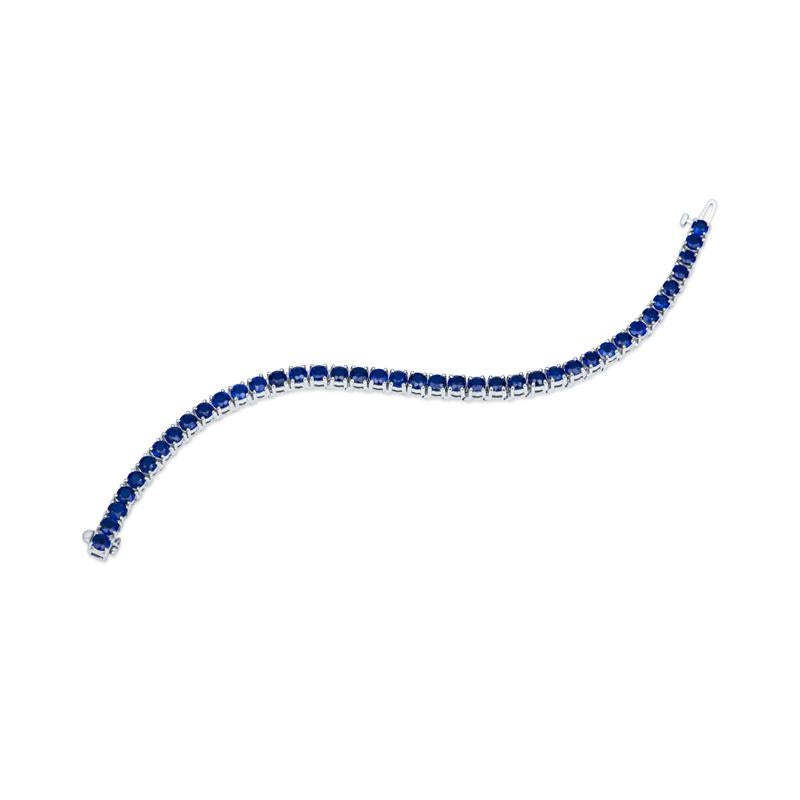 Brighten up your jewelry by wearing this unique bracelet. It features 12.23 carat total weight in bright cobalt blue spinels set in 18 karat white gold. Wear alone for a statement or layer with your other favorite bracelets. 
Length: 7