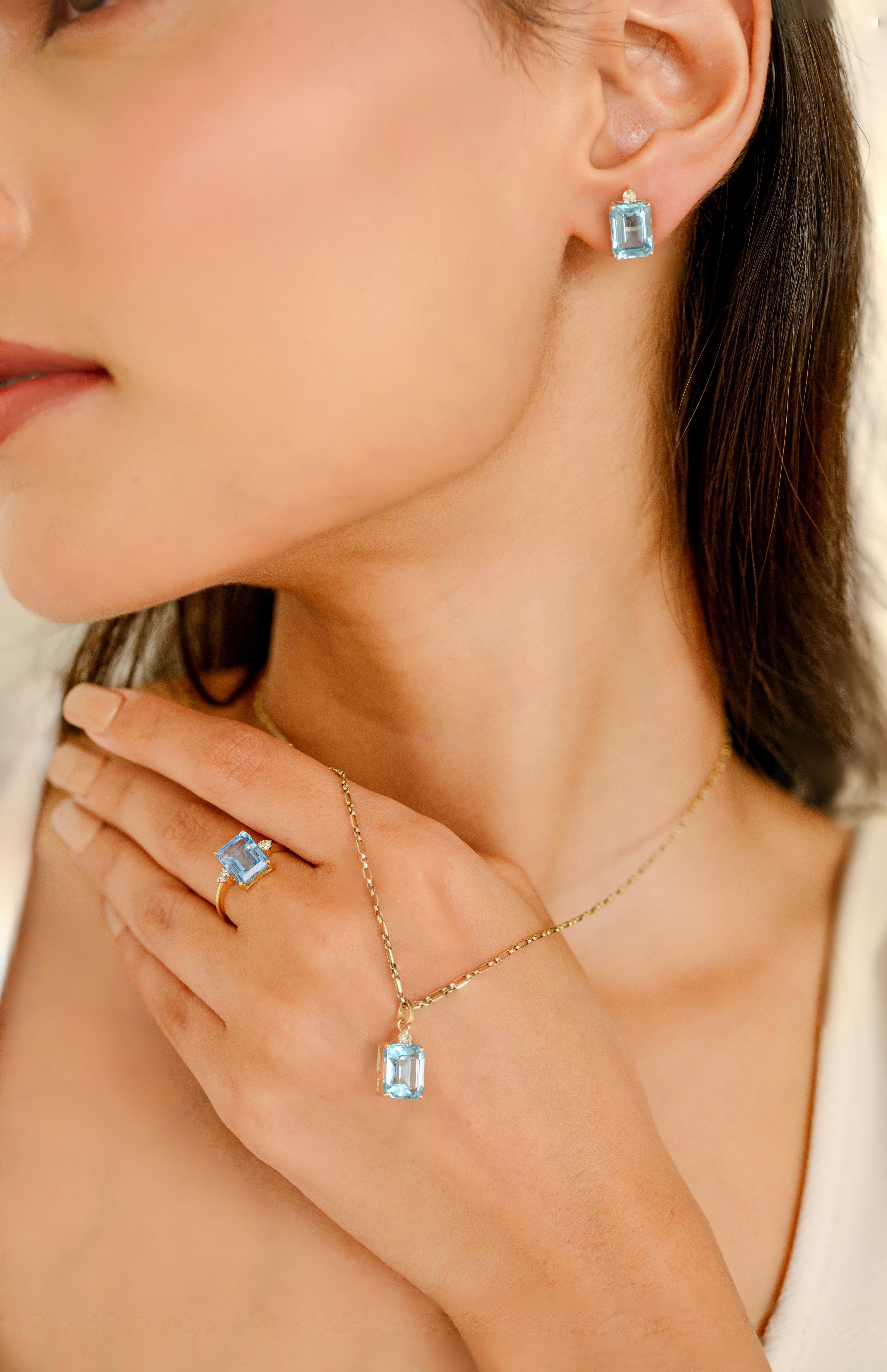 12.23 CTW Blue Topaz Diamond Ring Pendant Earrings Set in 18K Gold studded with octagon cut blue topaz with round cut diamonds. This stunning piece of jewelry instantly elevates a casual look or dressy outfit. 
Blue topaz promotes truth and