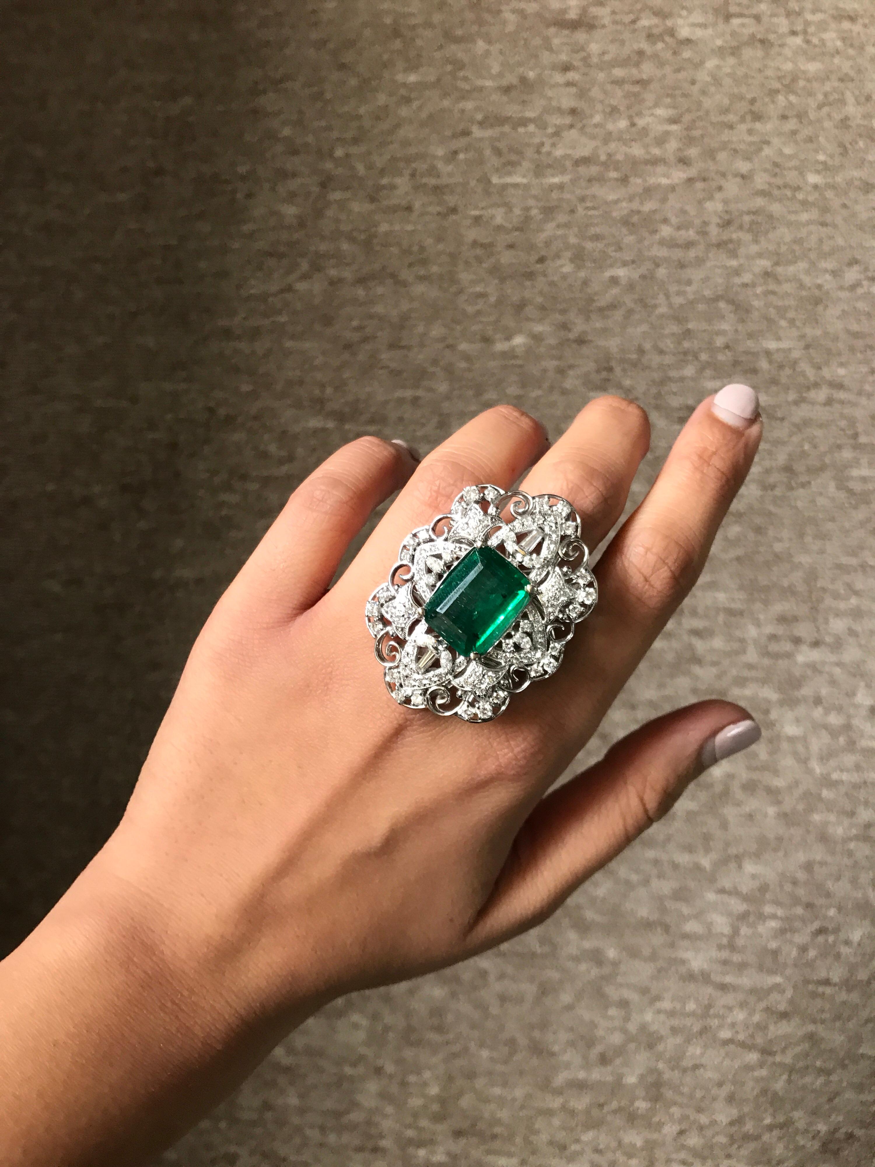 An art-deco looking, eye-catching 12.24 carat Emerald-cut Zambian Emerald cocktail ring, set with white Diamonds in 18k white Gold. This ring will surely make a statement!
Currently a ring size US 6.5, but the ring can be resized without additional