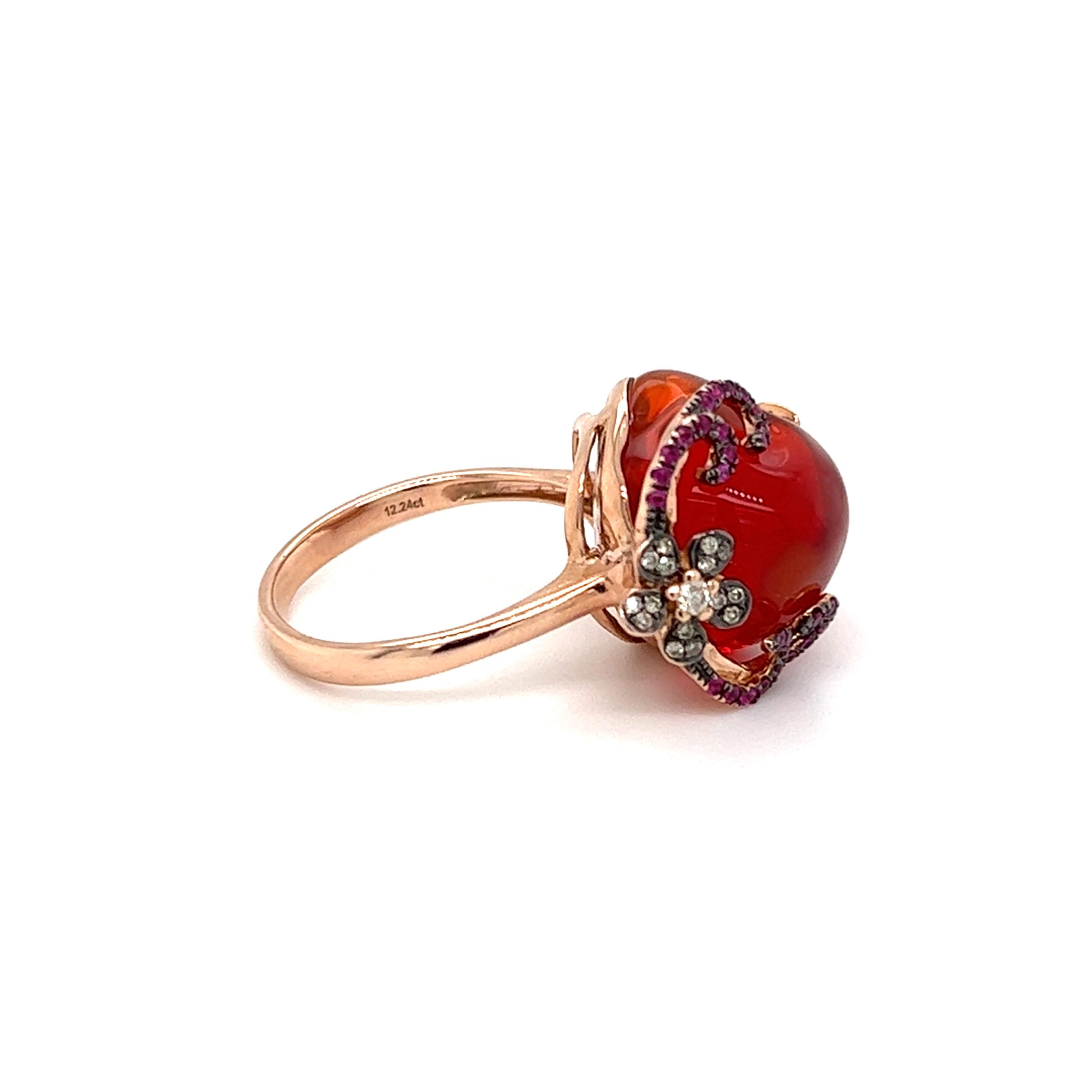 One 14 karat rose gold ring featuring one (1) 12.24-carat polished nugget shape Mexican fire opal, twenty-eight (28)  round brilliant cut diamonds, weighing approximately 0.09-carat total weight with matching top light brown color and VS clarity,