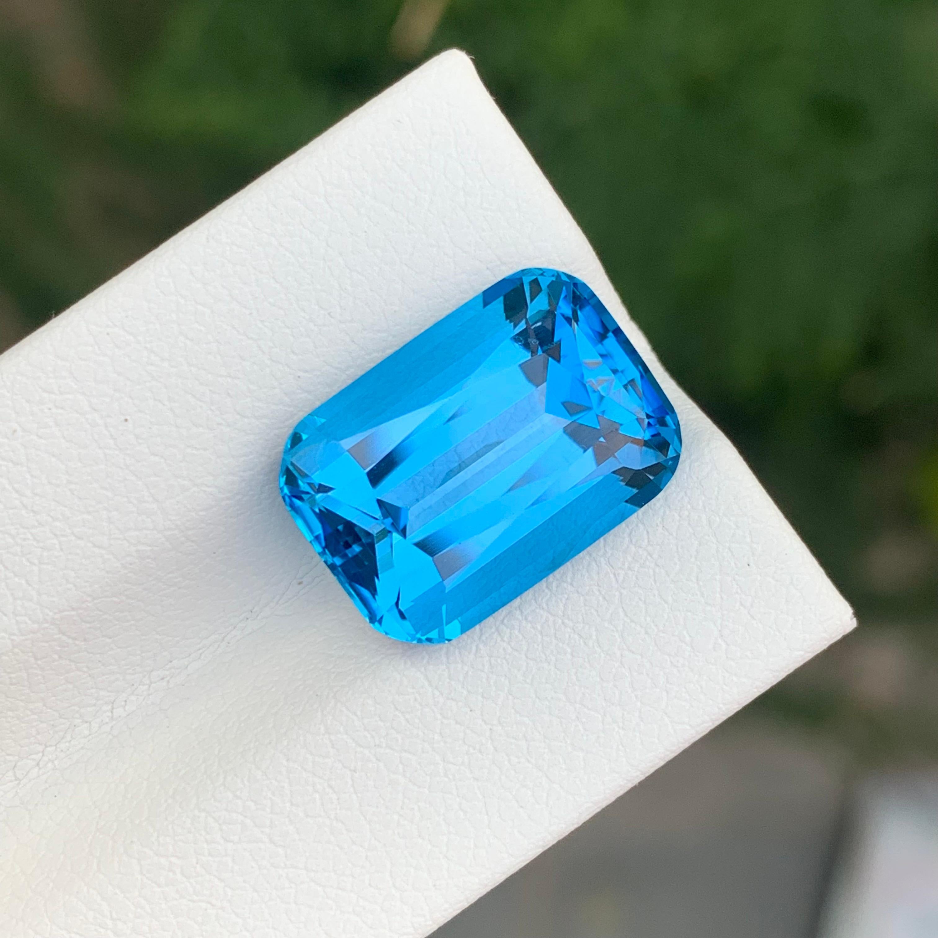Women's or Men's 12.25 Carat Excellent Loose Swiss Blue Topaz Long Cushion Shape Gemstone For Sale