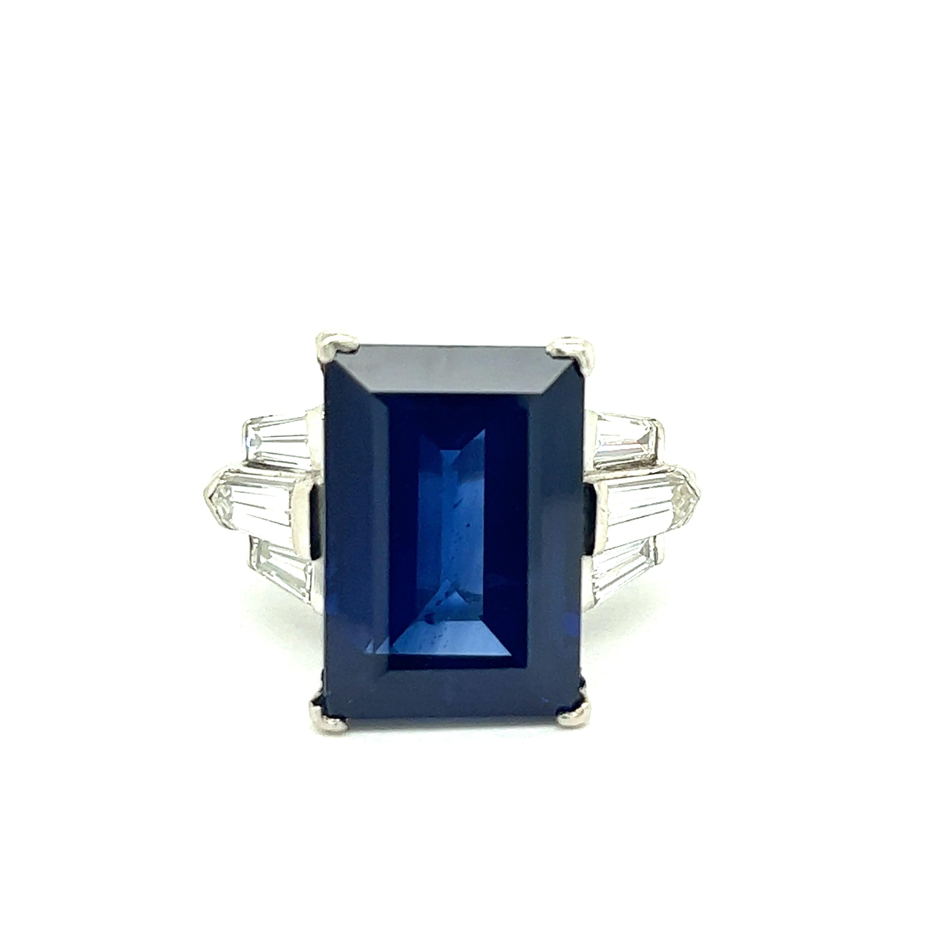 Sapphire Diamond Cocktail Ring

Rectangular step-cut sapphire of 12.25 carats (16.01 x 10.94 x 6.41 mm), with four near-colorless tapered baguette diamonds and two modified kite step-cuts; mounted on platinum 

Size: 6.25 US
Total weight: 11.7