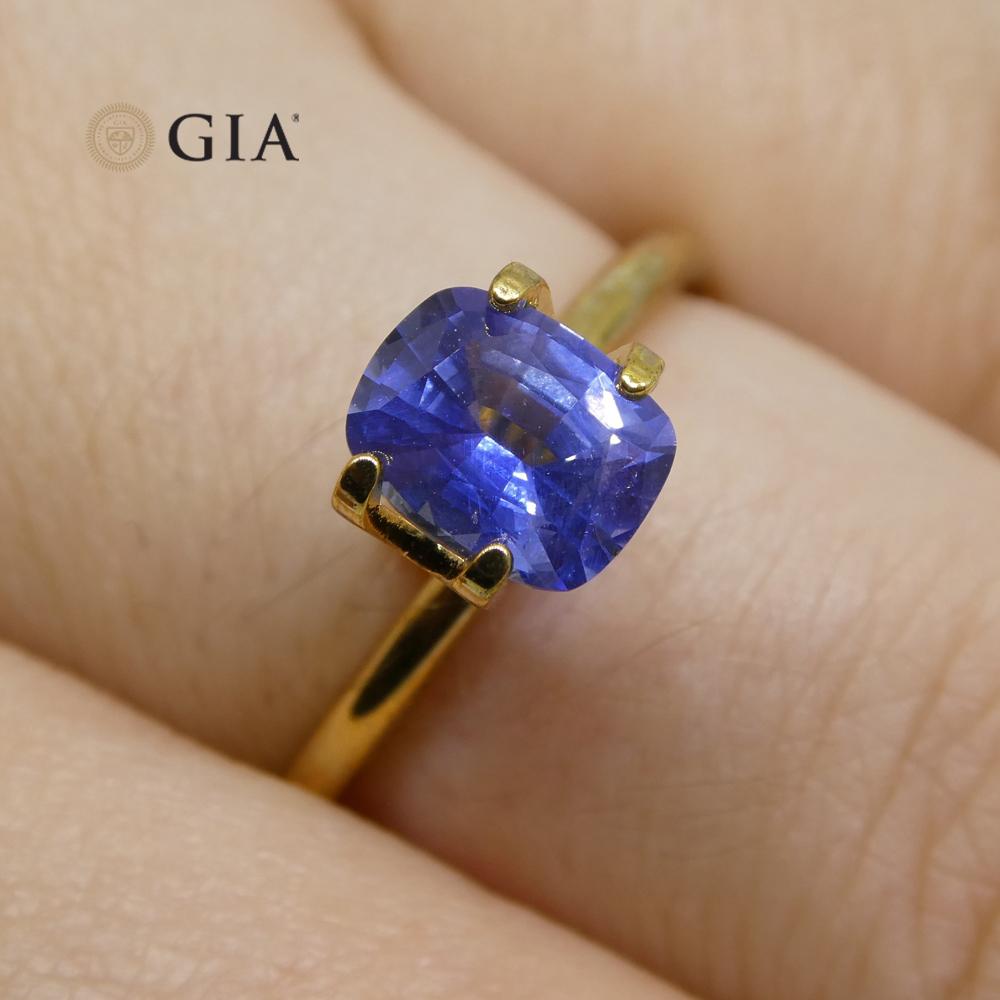This is a stunning GIA Certified Sapphire 

The GIA report reads as follows:

GIA Report Number: 2205978306
Shape: Cushion
Cutting Style: 
Cutting Style: Crown: Brilliant Cut
Cutting Style: Pavilion: Step Cut
Transparency: Transparent
Color: