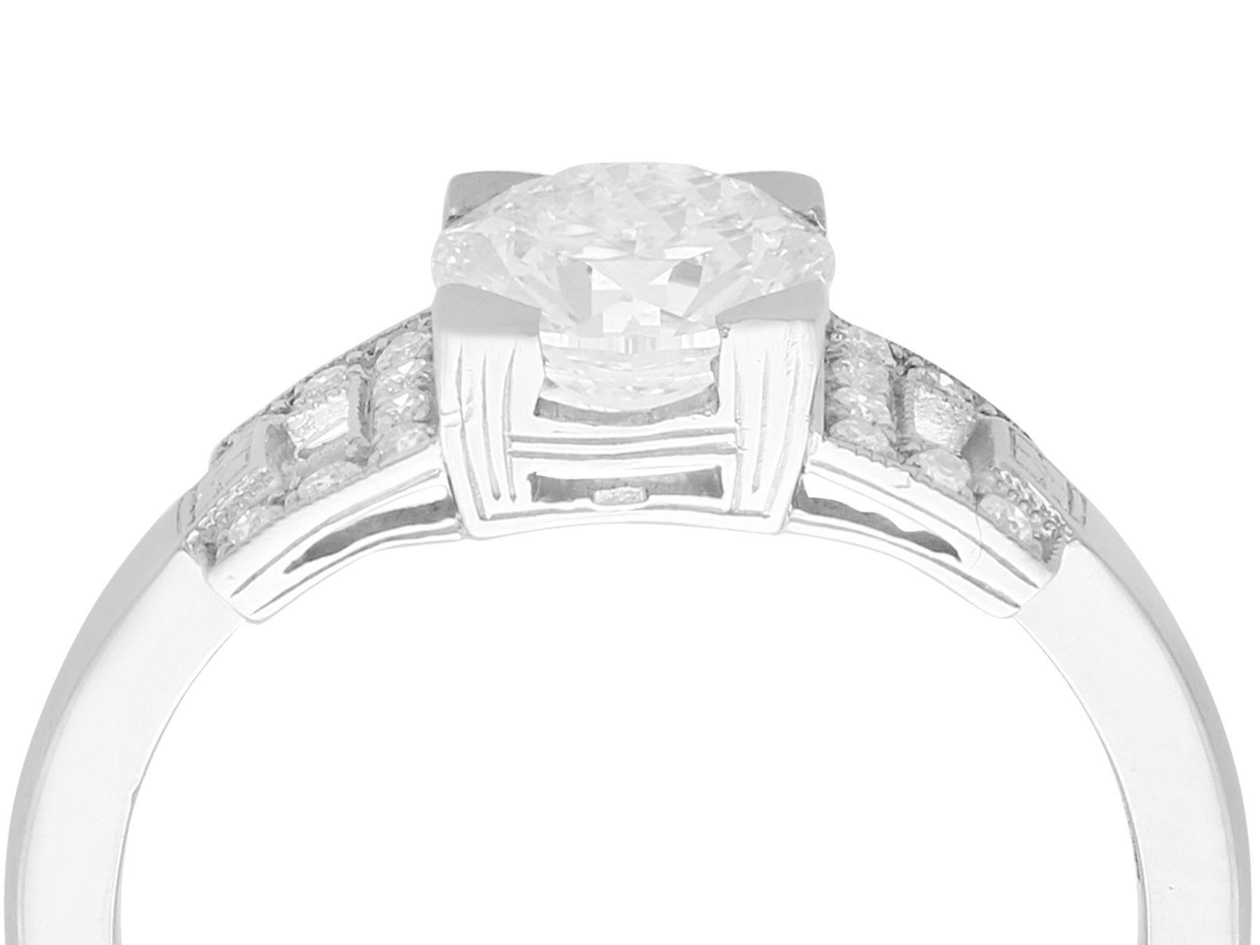 A stunning, fine and impressive vintage 1.22 carat diamond (total) and contemporary platinum solitaire ring; part of our diamond jewelry/estate jewelry collections.

This stunning, fine and impressive 1.1 carat diamond solitaire ring has been