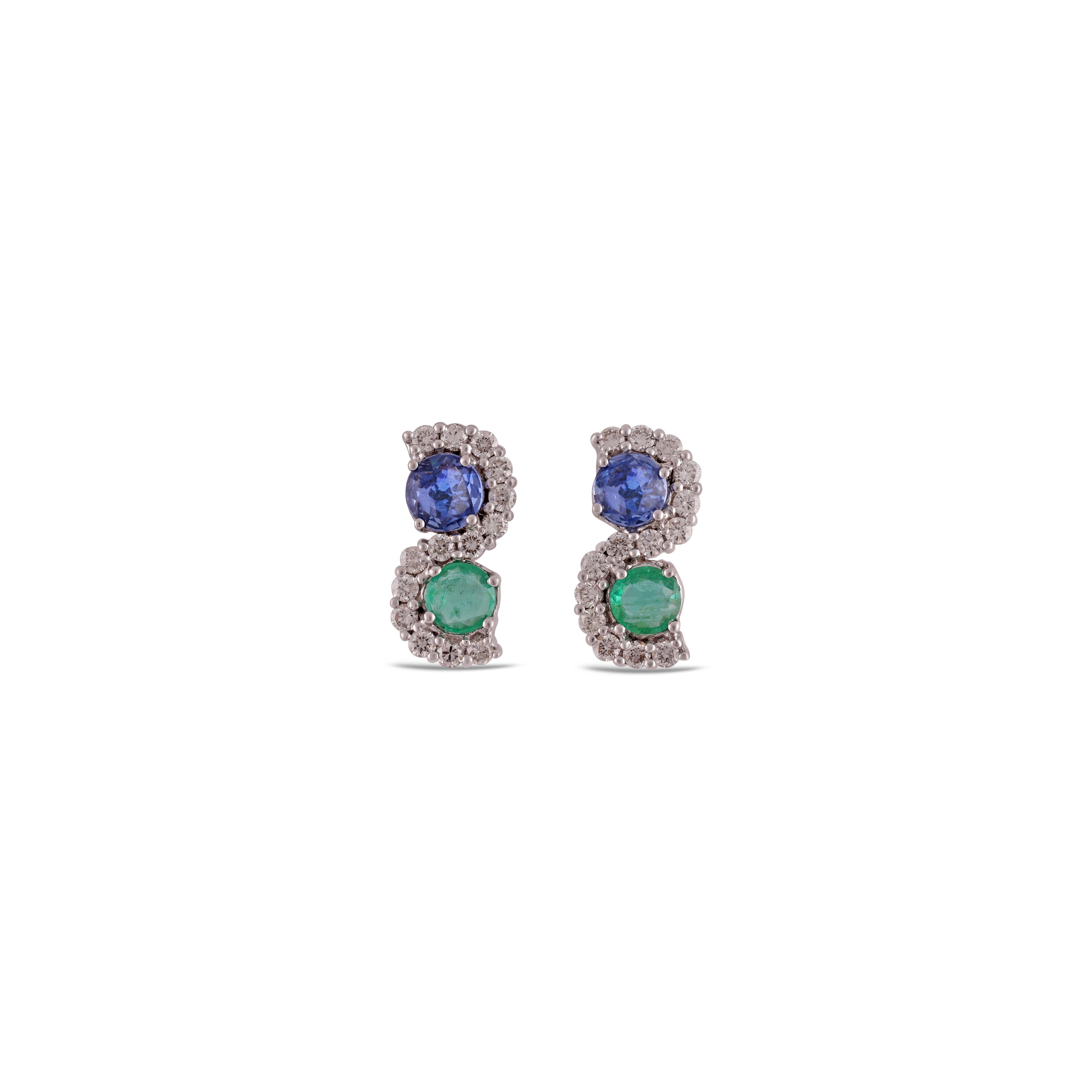 A stunning, fine and impressive pair of  1.23 carat blue sapphire, Emerald 0.67 Carat  & 0.56 Carat  Diamond with Solid 18k Gold. 

Studs create a subtle beauty while showcasing the colors of the natural precious gemstones and illuminating diamonds