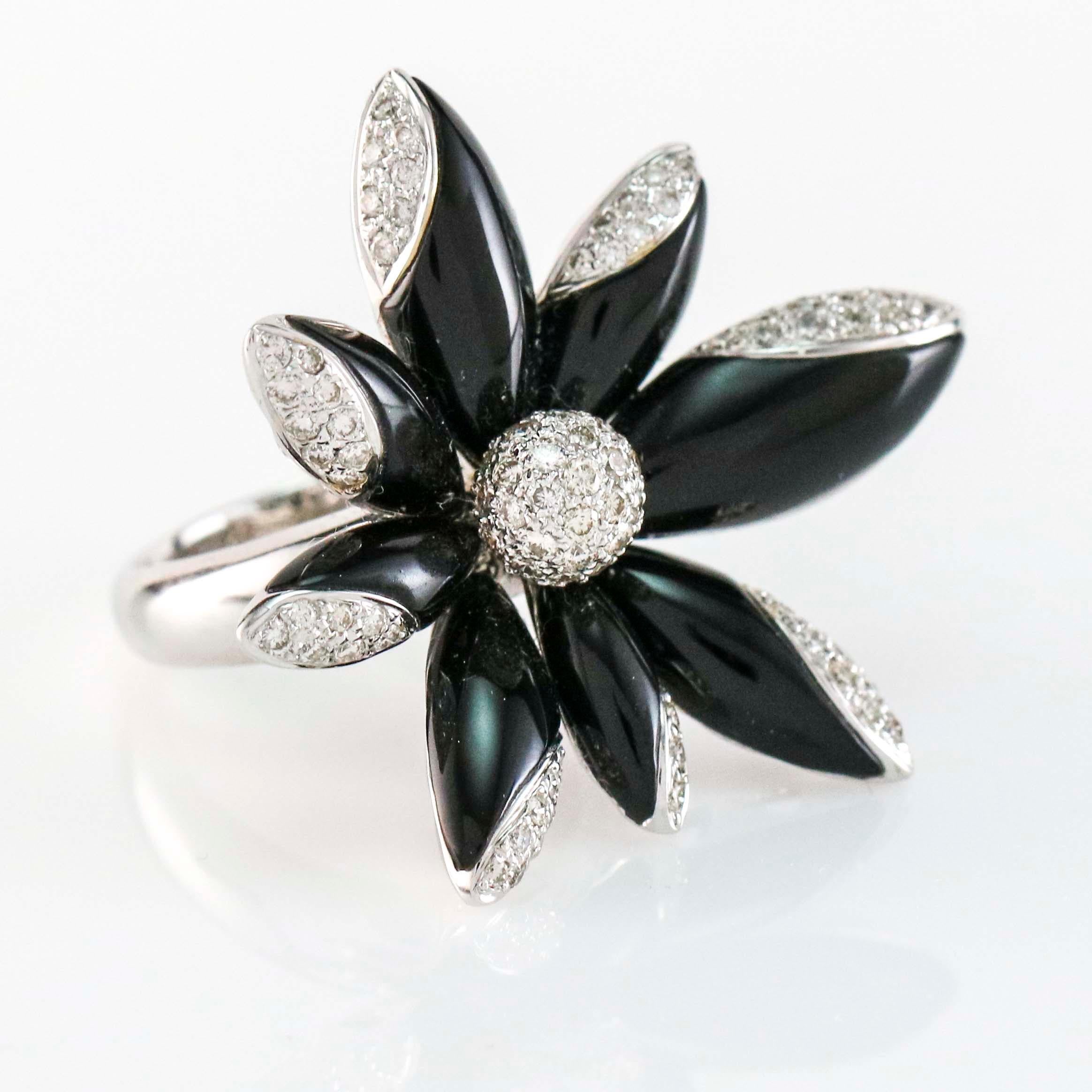 Black onyx flower cocktail ring crafted in 18 karat white gold with 1.23 carats of round brilliant cut diamonds. Size 7. 
