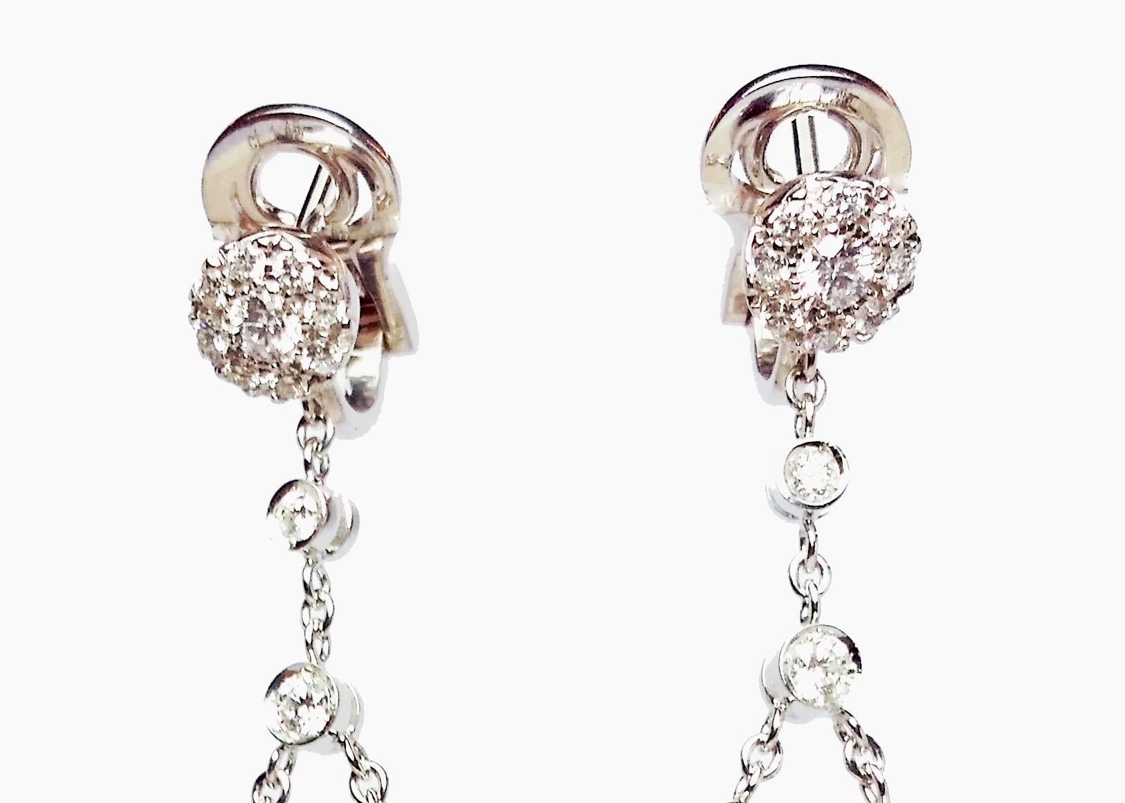 18 Karat White Gold Tassel Earrings Featuring 82 Round Diamonds Of VS Clarity & G Color Totaling 1.23 Carats. Pierced Post With Clip Back For Support. 