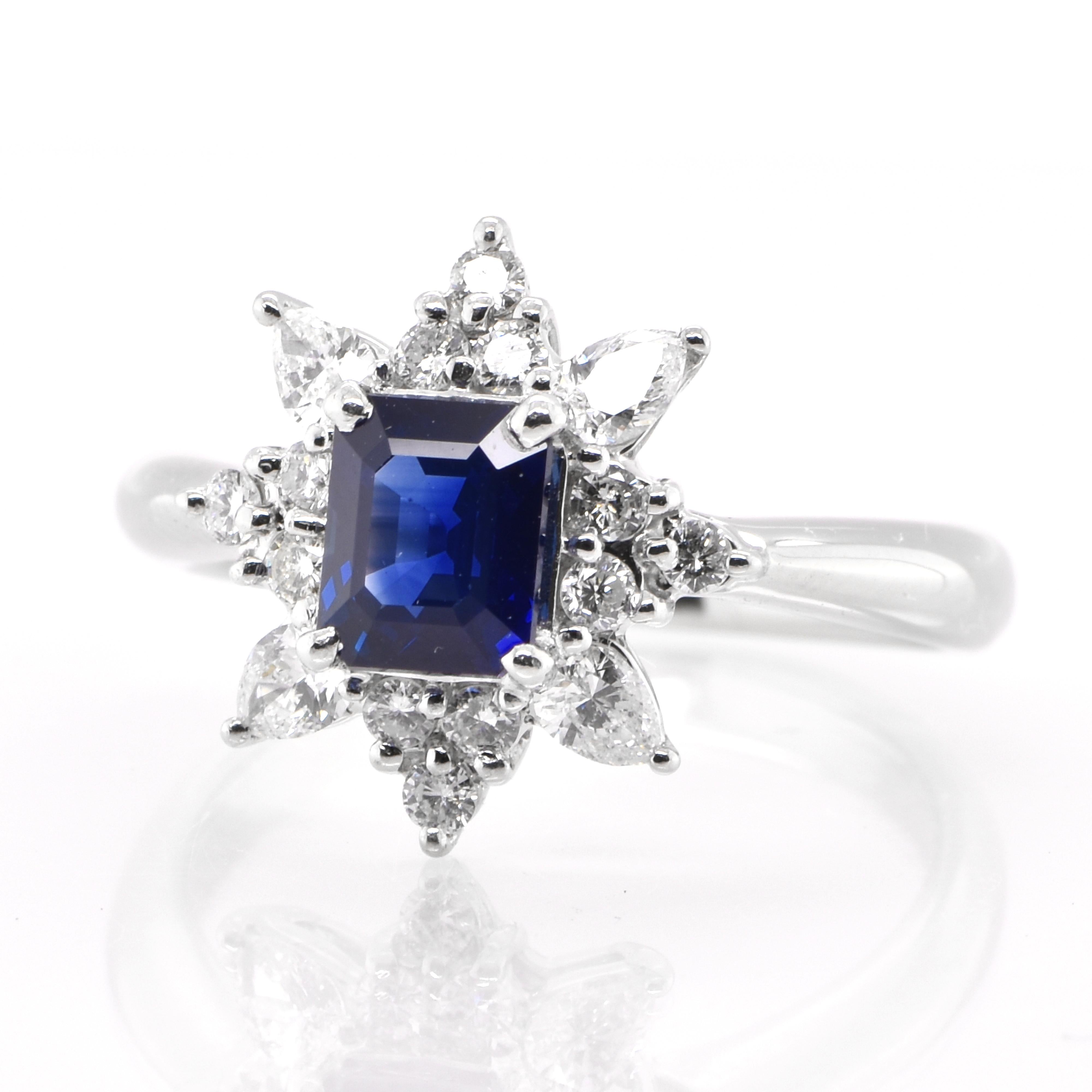 A beautiful Halo Ring featuring a 1.23 Carat Natural Emerald-cut Sapphire and 0.53 Carats Diamond Accents set in Platinum. Sapphires have extraordinary durability - they excel in hardness as well as toughness and durability making them very popular