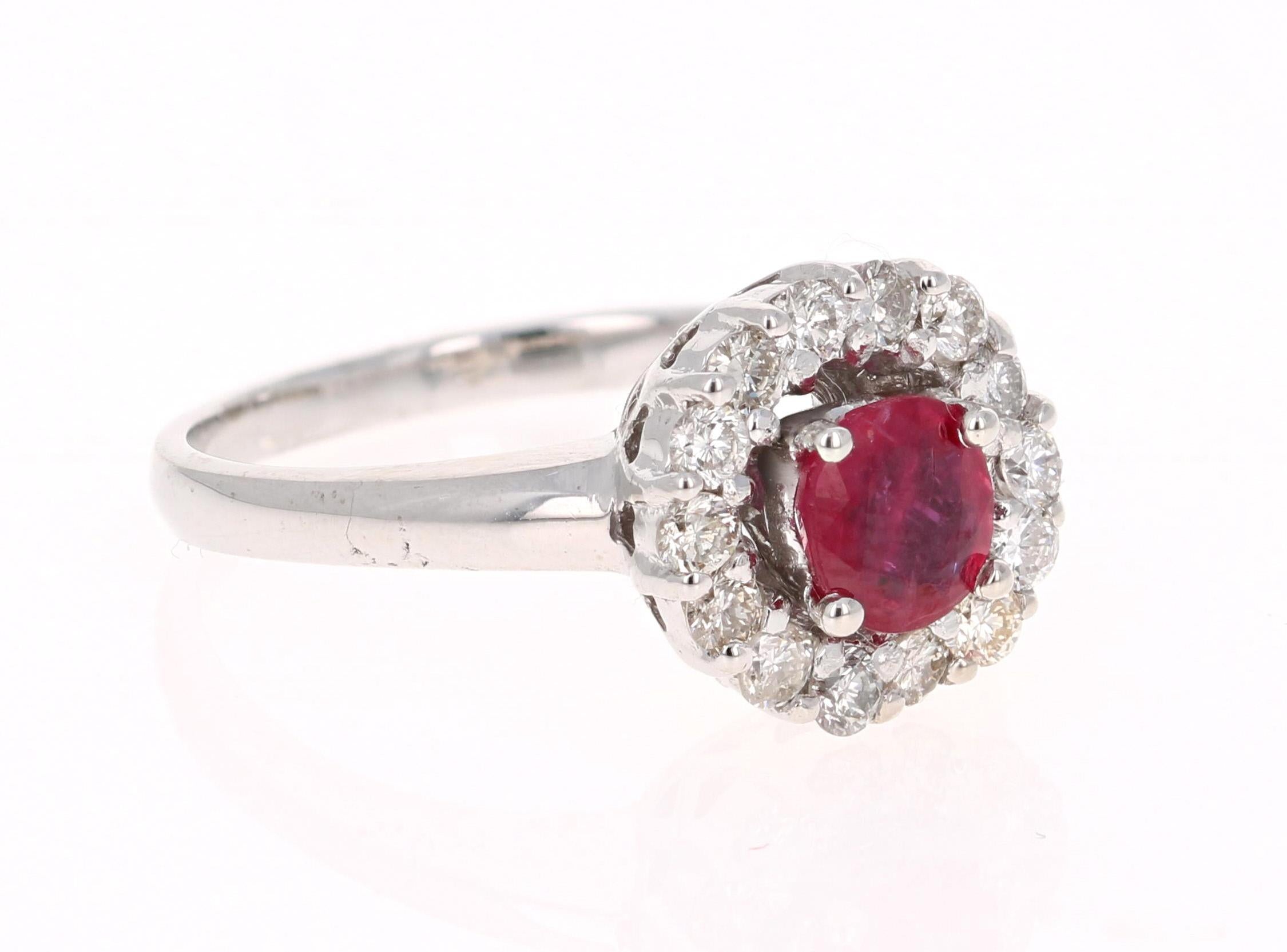 Simply beautiful Ruby Diamond Ring with a Round Cut 0.74 Carat Burmese Ruby which is surrounded by 14 Round Cut Diamonds that weigh 0.49 carats. The total carat weight of the ring is 1.23 carats.

The ring is casted in 14K White Gold and weighs
