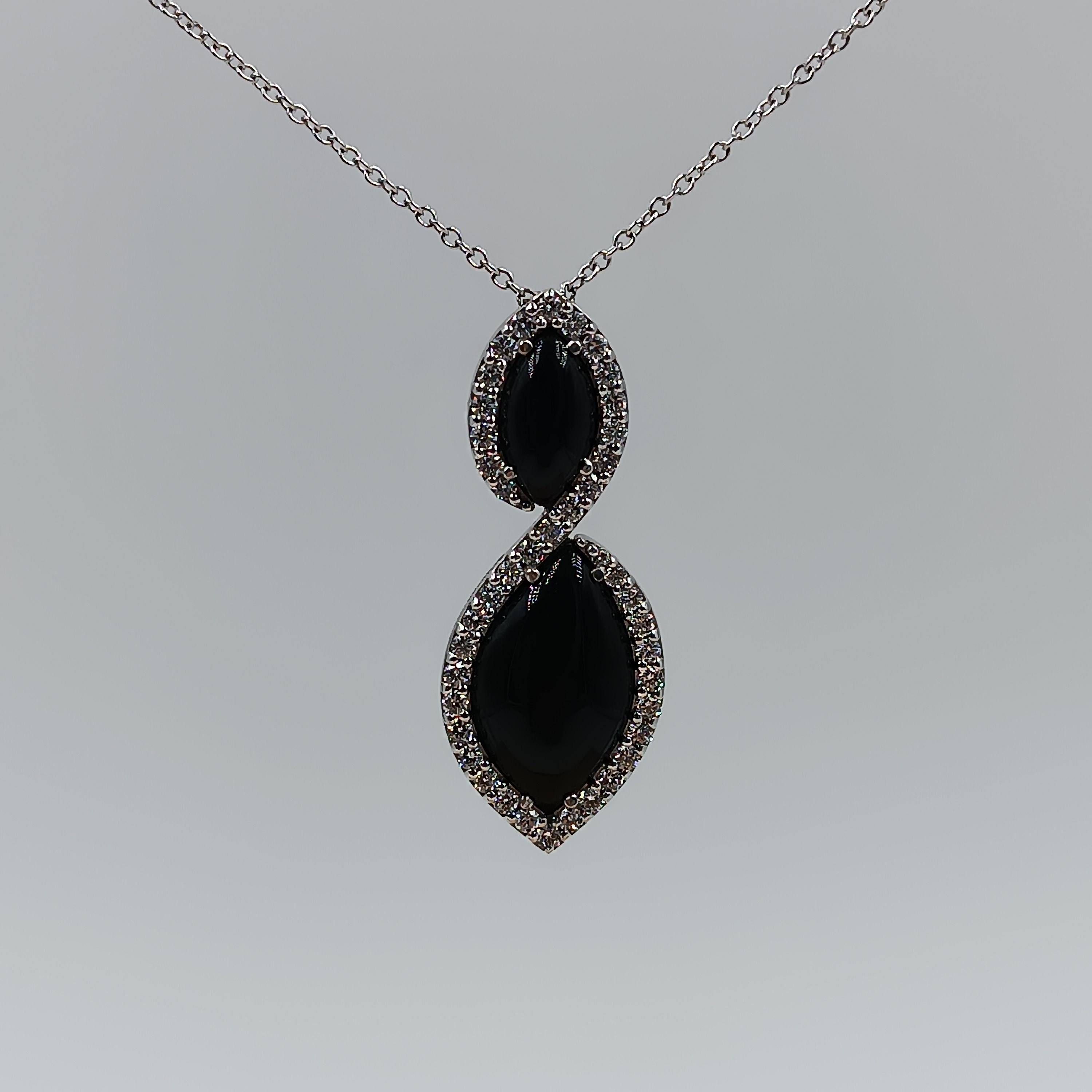This wonderful Leo Milano pendant from our Pagano collection shows in every detail a very complicate yet perfectly done workmanship. The pendant and the chain are in 18 carat white gold with black onyx . The object weights 12,08 grams the total
