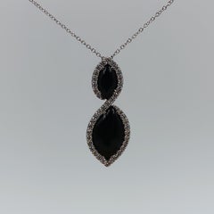 1.23 Carat VS G Diamonds on 18 Carat White Gold and Onyx Pendant