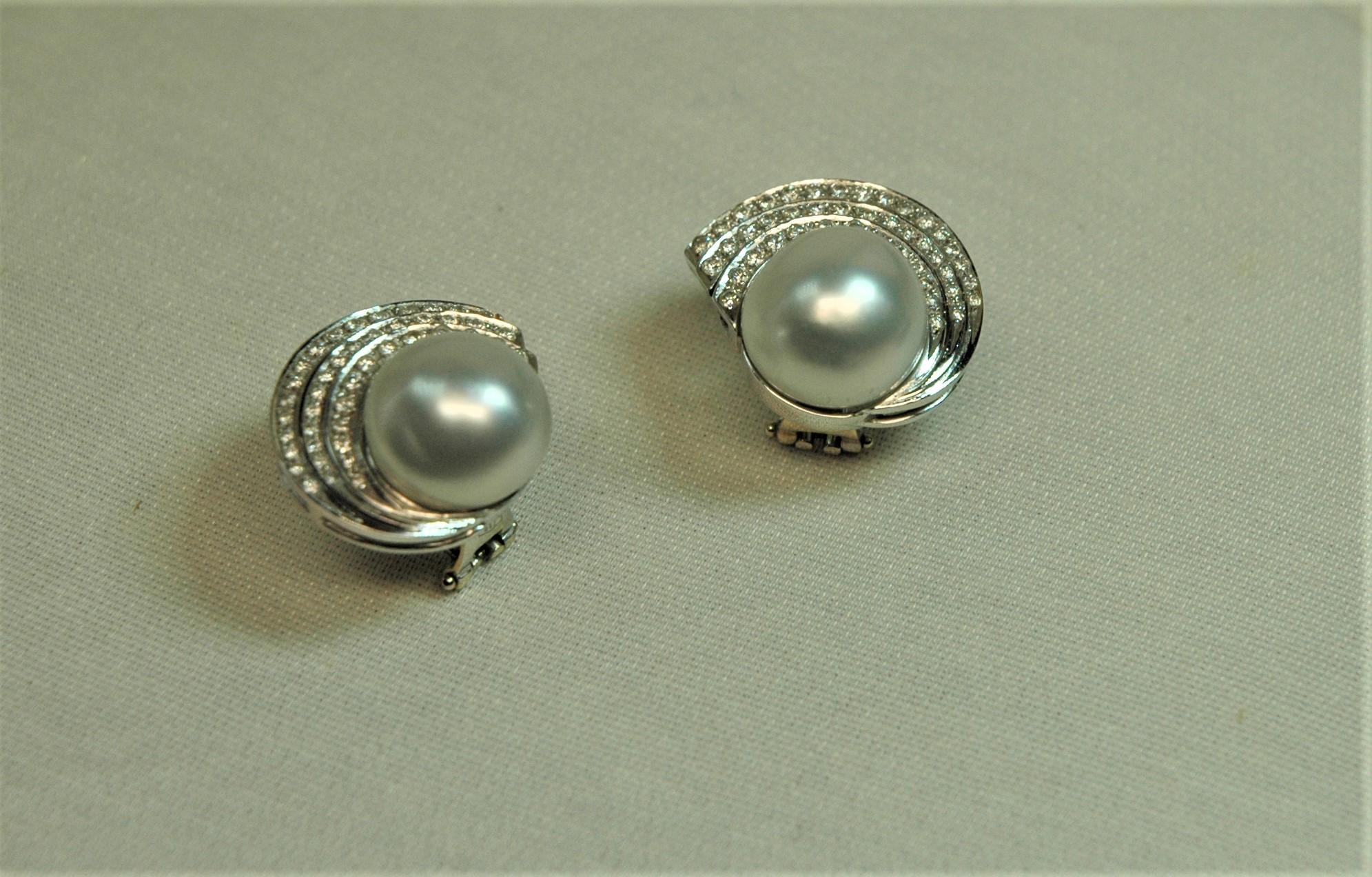 Very nice and elegant stud earrings with diamonds (1.23 carats) and natural Australian pearls. They give a fantastic light to your face. If you do not have the hole you can have the pin cut and wear them only with the clip.