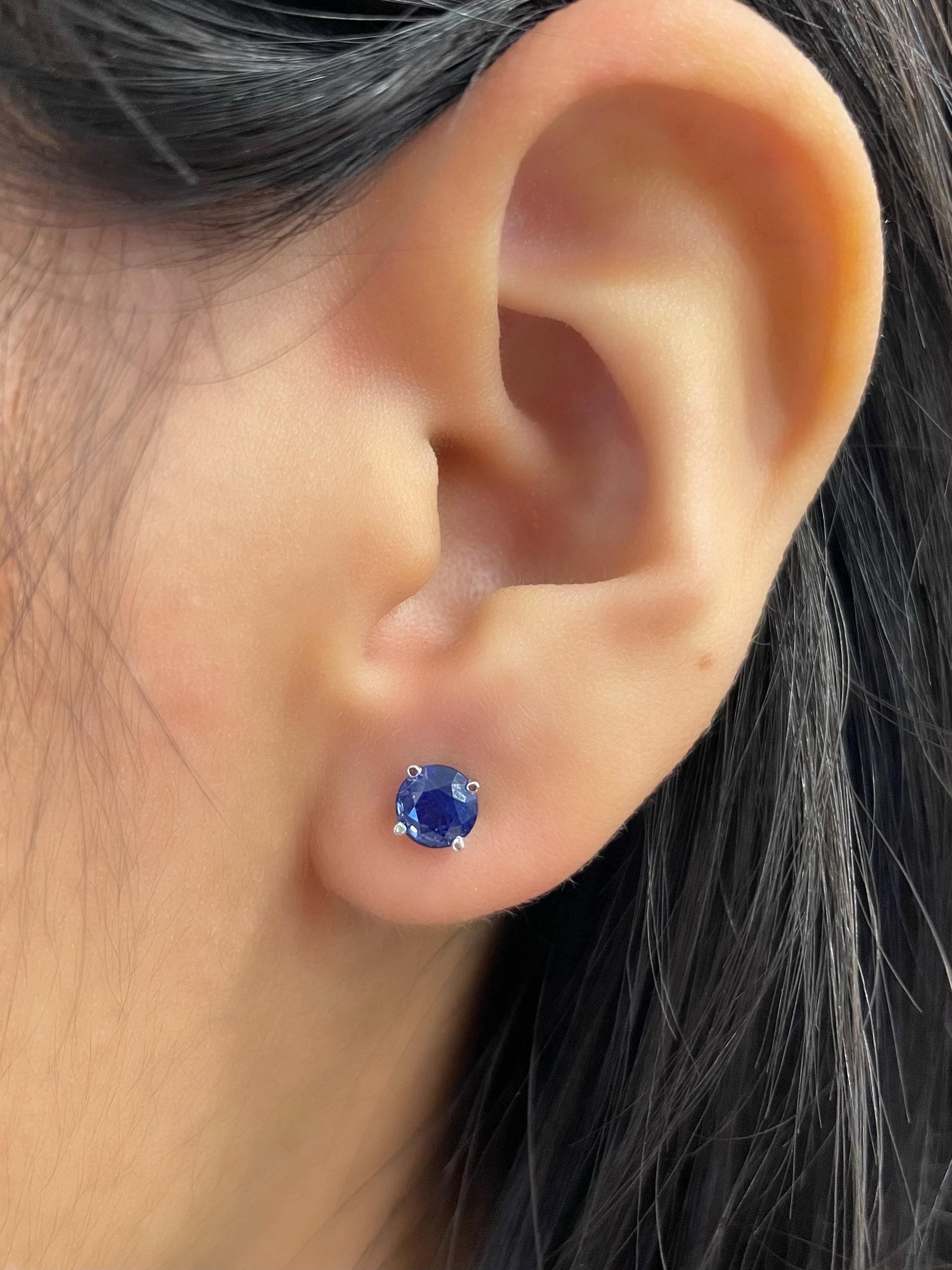 These stunning sapphire stud earrings feature 2 sapphires weighing 1.23 ct set in 14k white gold.