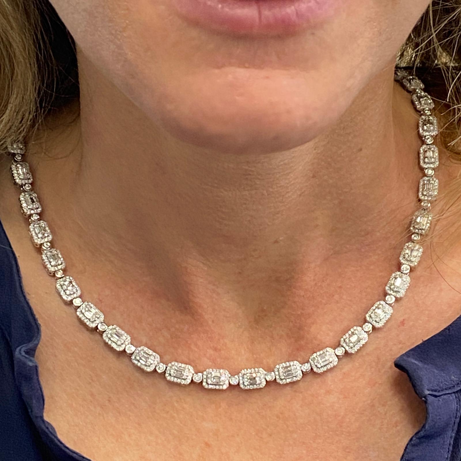 Beautiful modern diamond link necklace fashioned in 14 karat white gold. The necklace features 12.30 carat total weight of round and baguette cut diamonds. The diamonds are graded H-I color and SI clarity, and the necklace measures 18 inches in